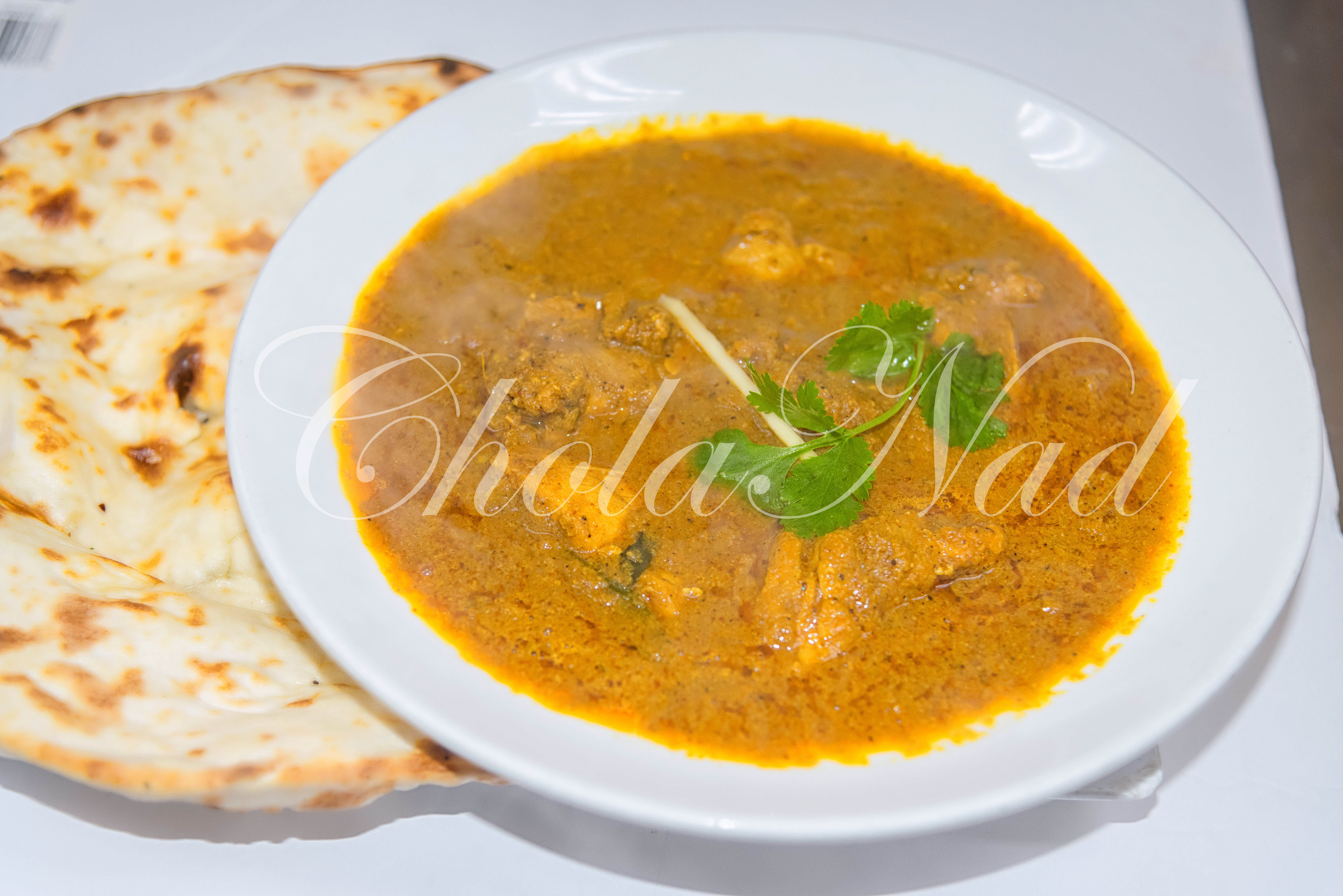 Order Chetinad Chicken curry with choice of Set Dosa or Egg Dosa or Parota bread food online from Cholanad store, Chapel Hill on bringmethat.com