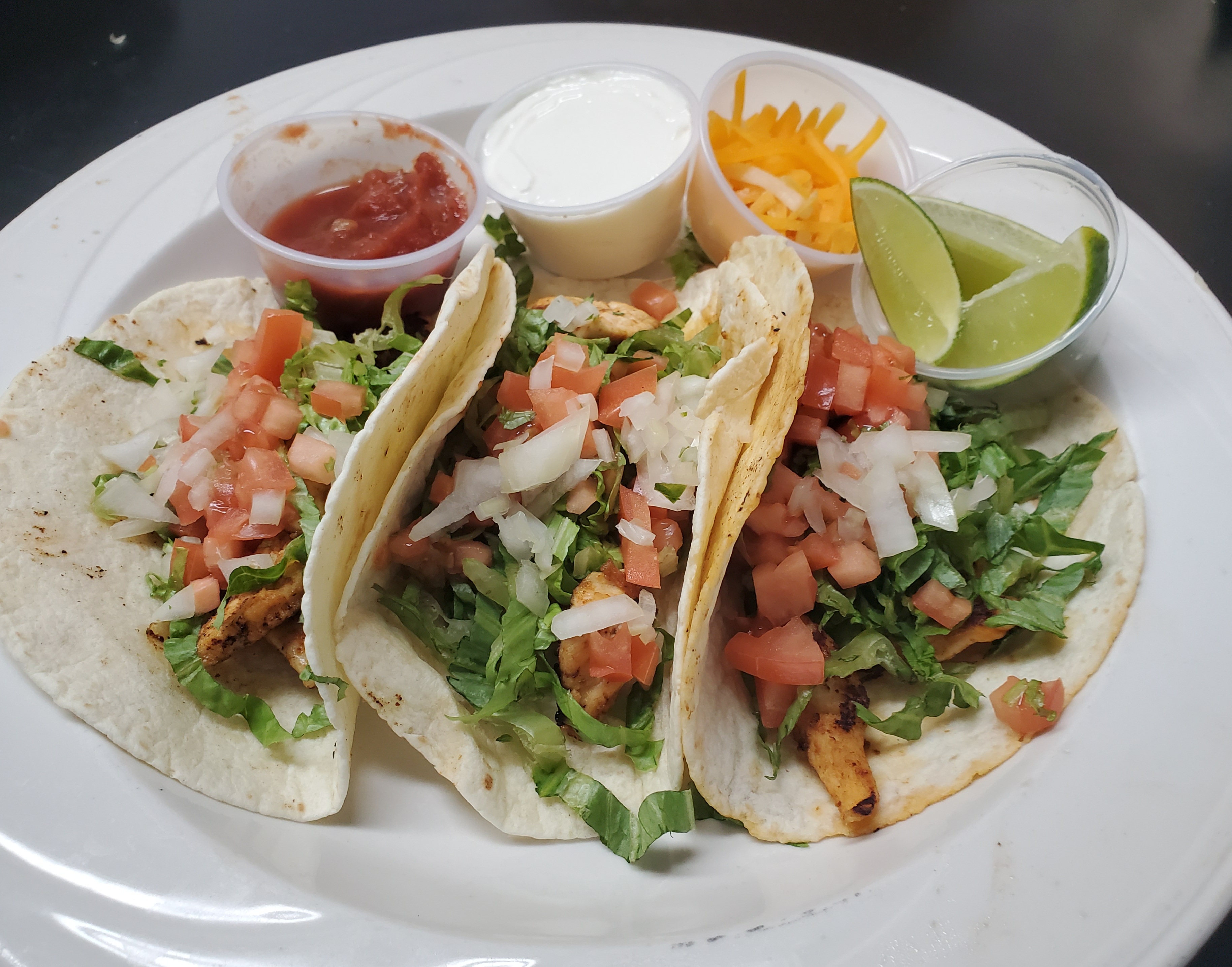 Order 3 Chicken Tacos  food online from Juanito Mexican Grill store, Riviera Beach on bringmethat.com