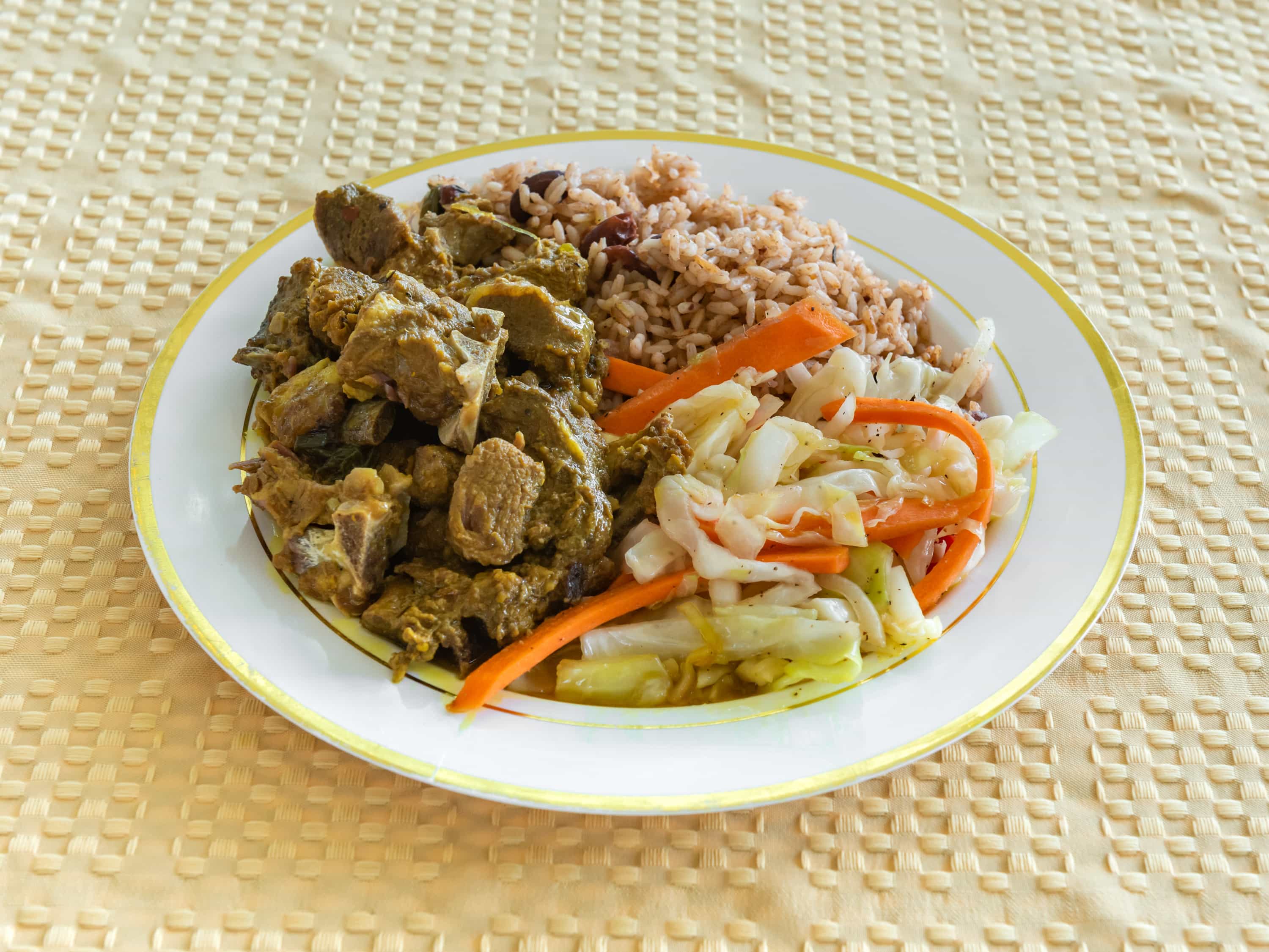 Order Curry Goat includes rice & cabbage food online from Iwayne Caribbean Kitchen store, Manor on bringmethat.com