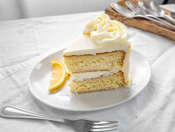Order Lemon on Lemon Layered Cake Slice food online from Pound Cake Heaven store, Yeadon on bringmethat.com