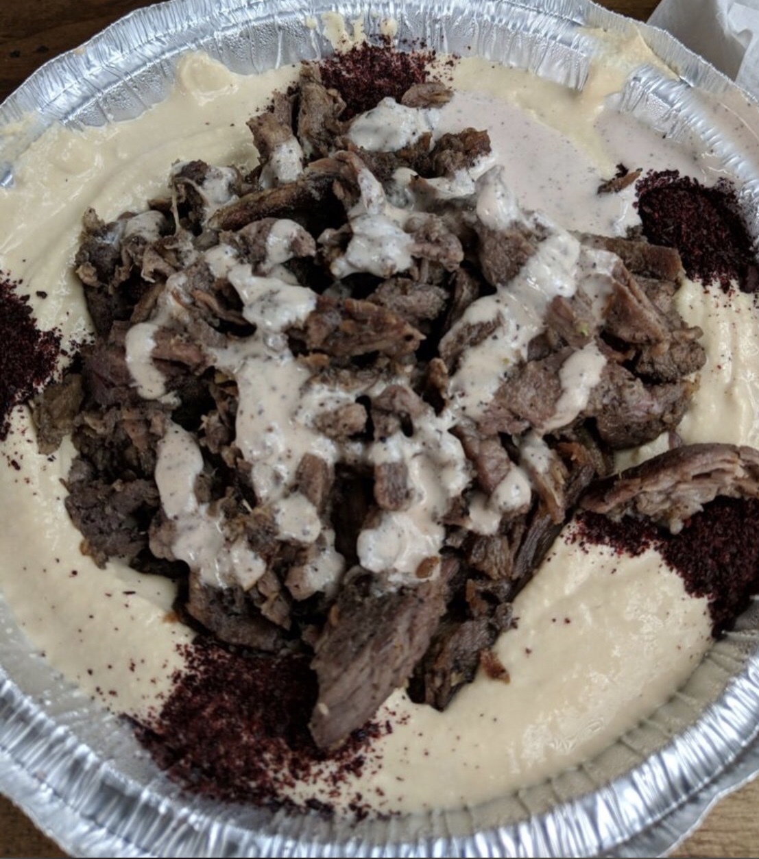 Order Hummus Topped with Lamb Shawarma Plate  food online from Truly Mediterranean store, San Francisco on bringmethat.com