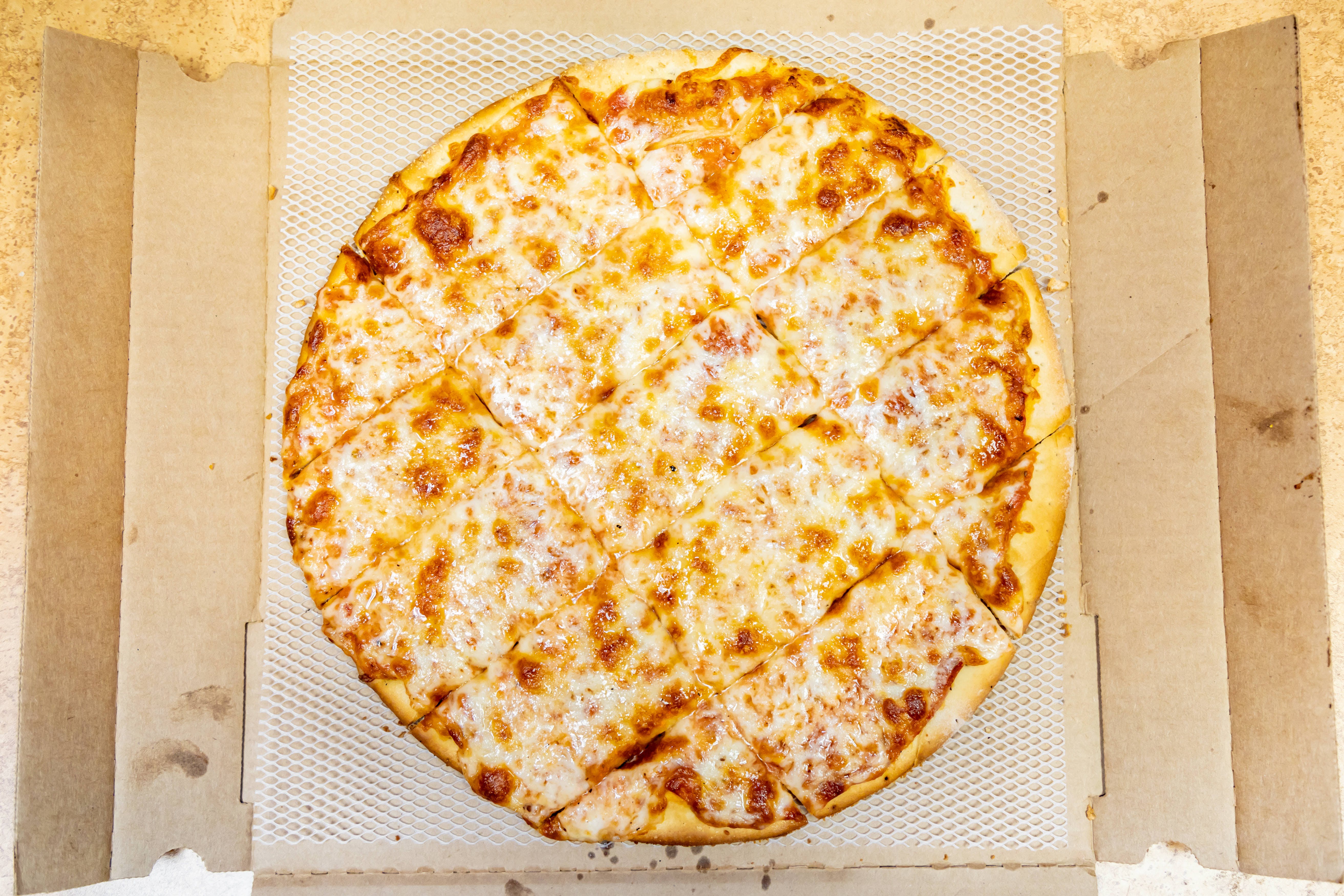 Order Famous Thin Crust Cheese Pizza - Small 12" (Serves 2-3 People) food online from Mario Pizza store, North Aurora on bringmethat.com