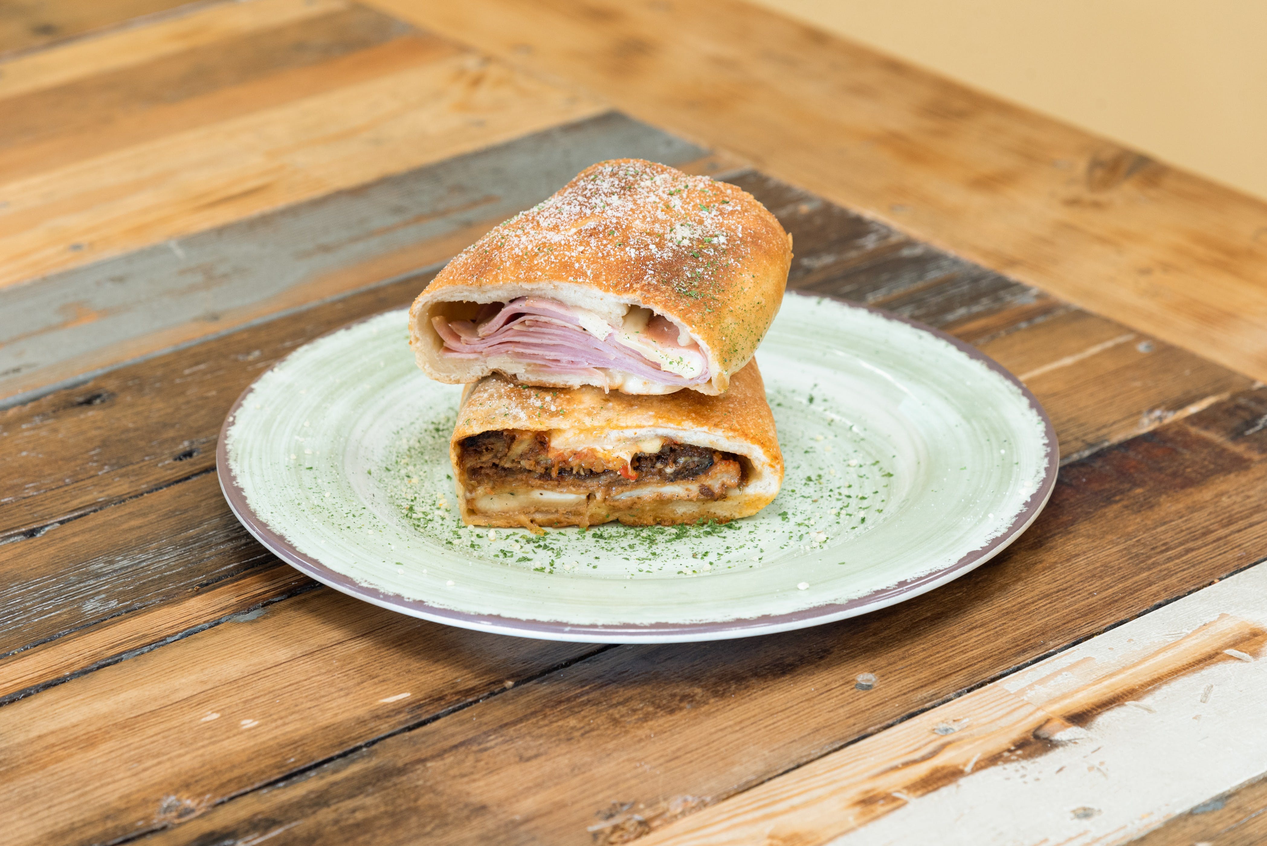 Order Ham & Cheese Calzone - 1 Foot food online from Milano's Delicatessen store, East Boston on bringmethat.com