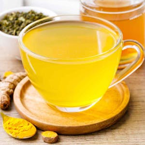 Order Golden Tumeric Tea - 16oz food online from Daylight Donuts Op store, Overland Park on bringmethat.com
