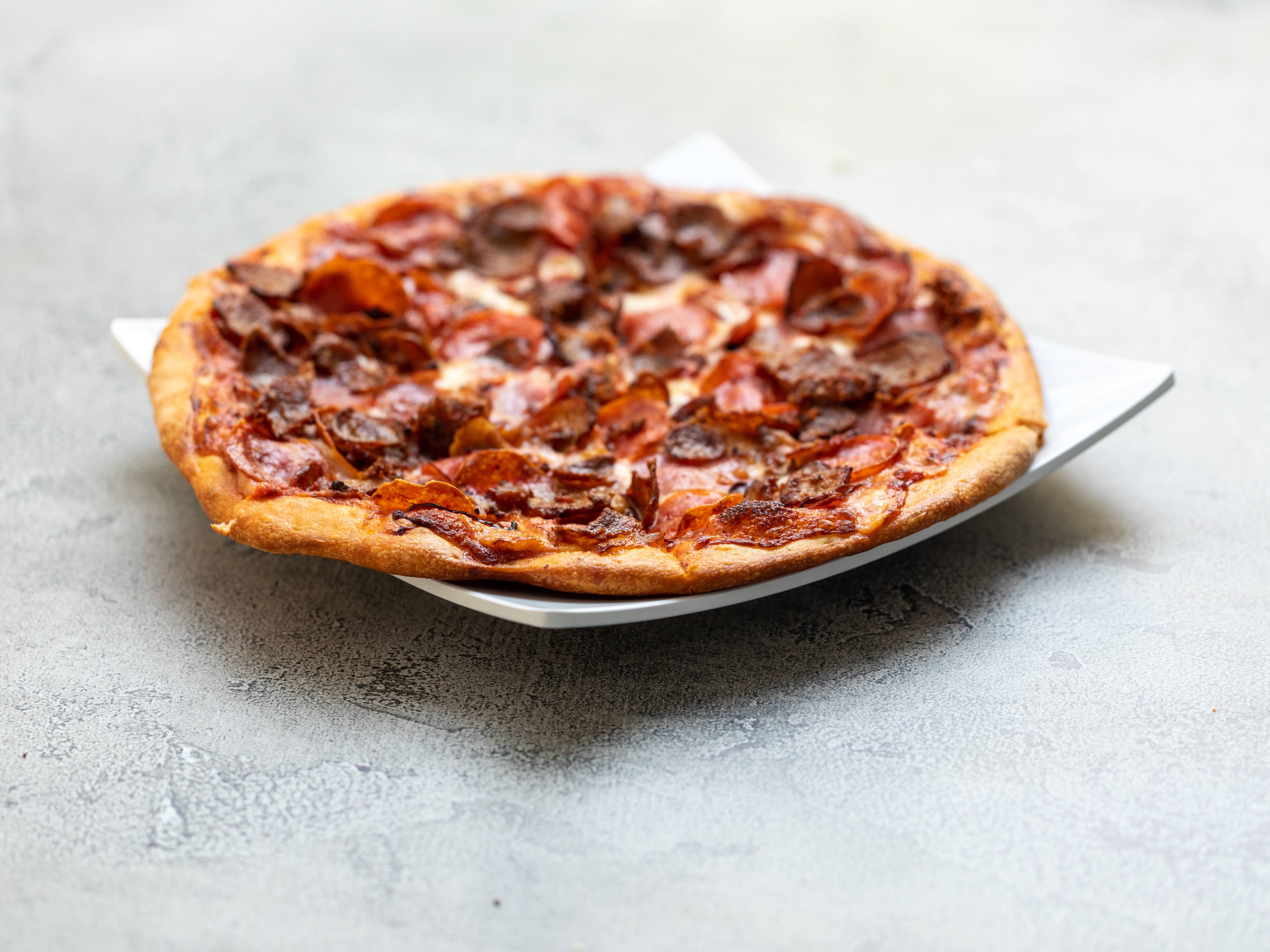Order Meat Lovers Pizza food online from Michael's Pizza store, Agoura Hills on bringmethat.com
