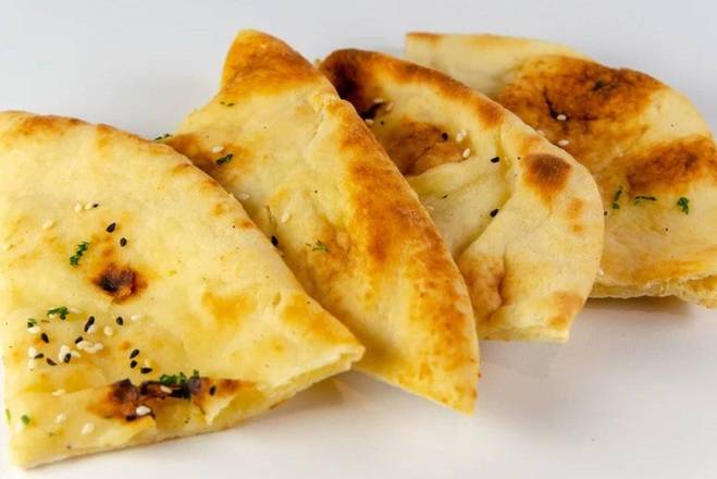 Order Kulcha Naan food online from Curry Up Now store, Lafayette on bringmethat.com