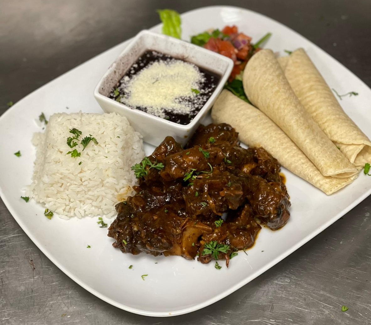 Order Roasted Oxtail Stew Plate food online from Casa Tacos Mexican Restaurant store, New York on bringmethat.com