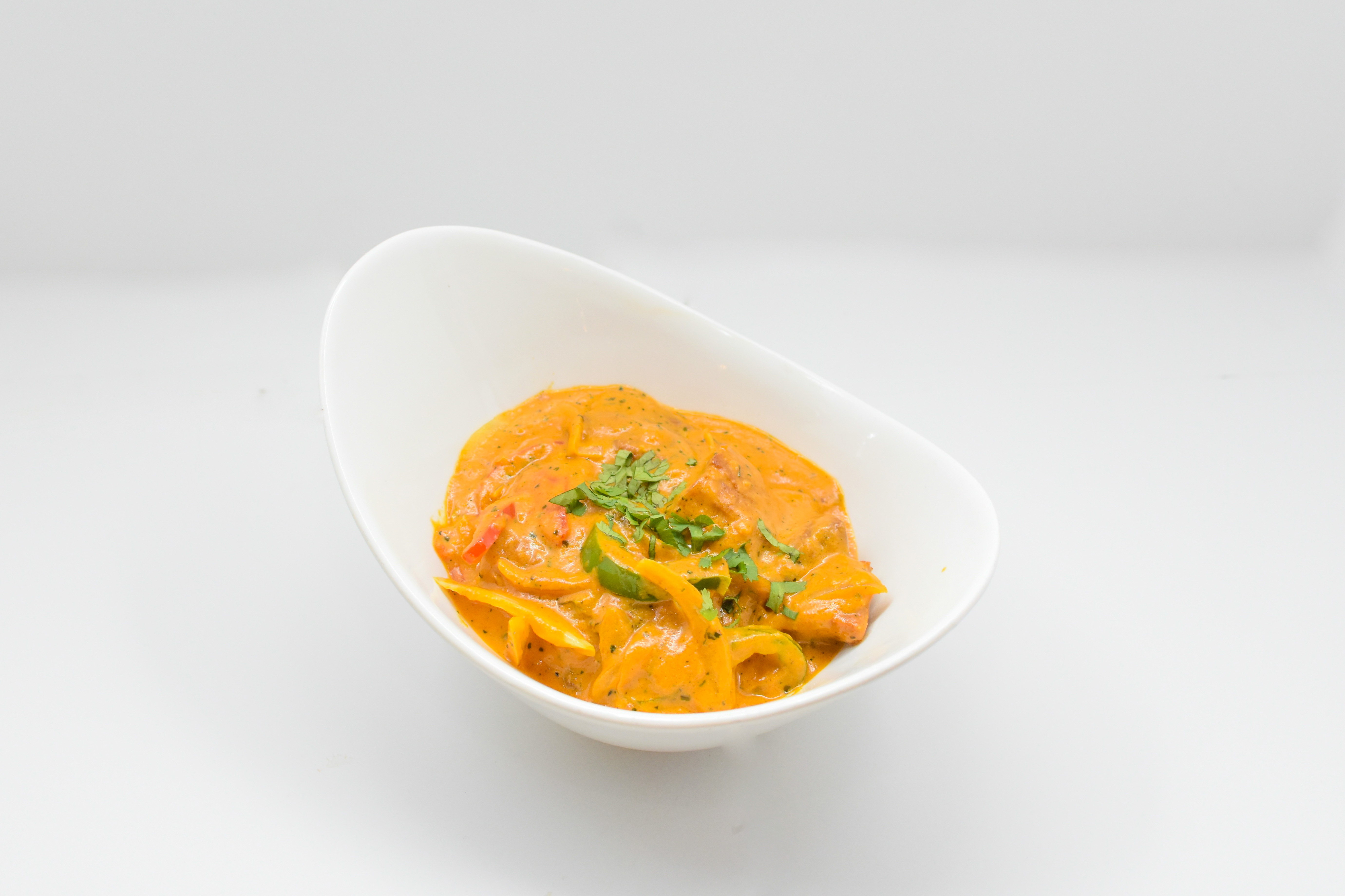 Order Madrasi Fish food online from Rangla Punjab Indian Cuisine store, Arlington on bringmethat.com