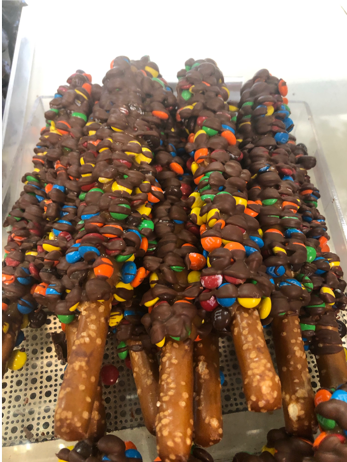 Order M&M pretzel rods food online from Rocky Mountain Chocolate Factory store, Albuquerque on bringmethat.com