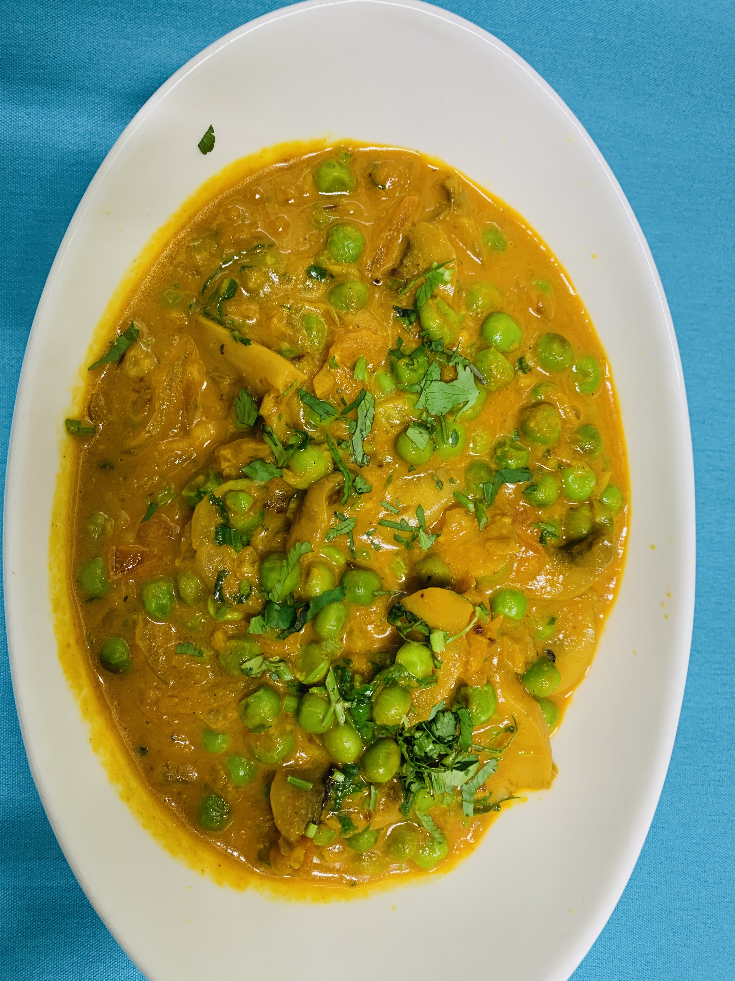 Order Dhingri Matar food online from Aahar Indian Cuisine store, New York on bringmethat.com