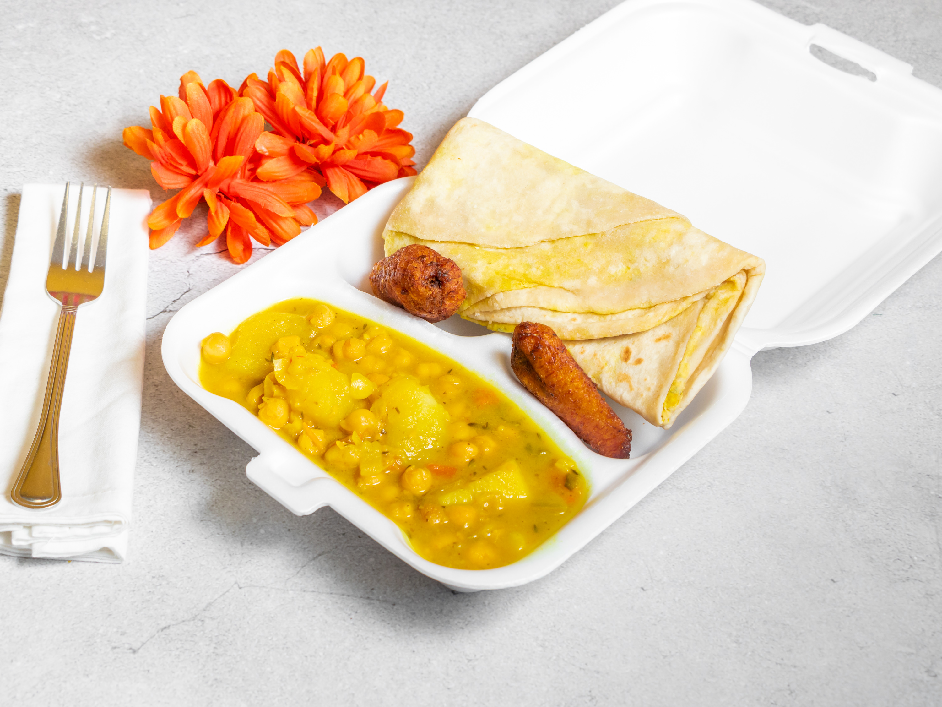 Order Curry Chick Peas and Curry Potatoes Roti food online from M & K Jamaican store, Huntsville on bringmethat.com