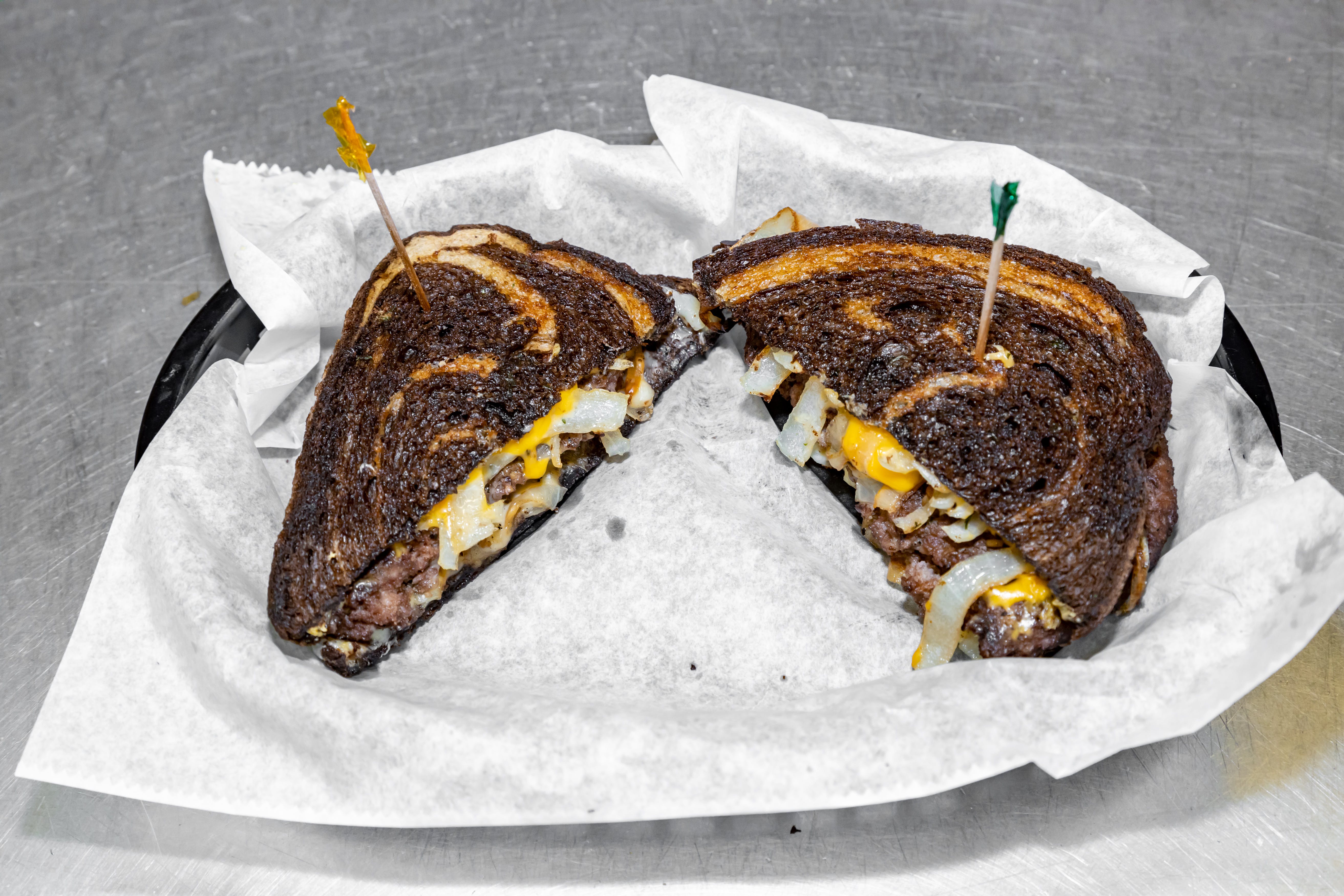 Order Patty Melt Burger - 1/2 lb. food online from Luconi's Pizza store, Bradley on bringmethat.com