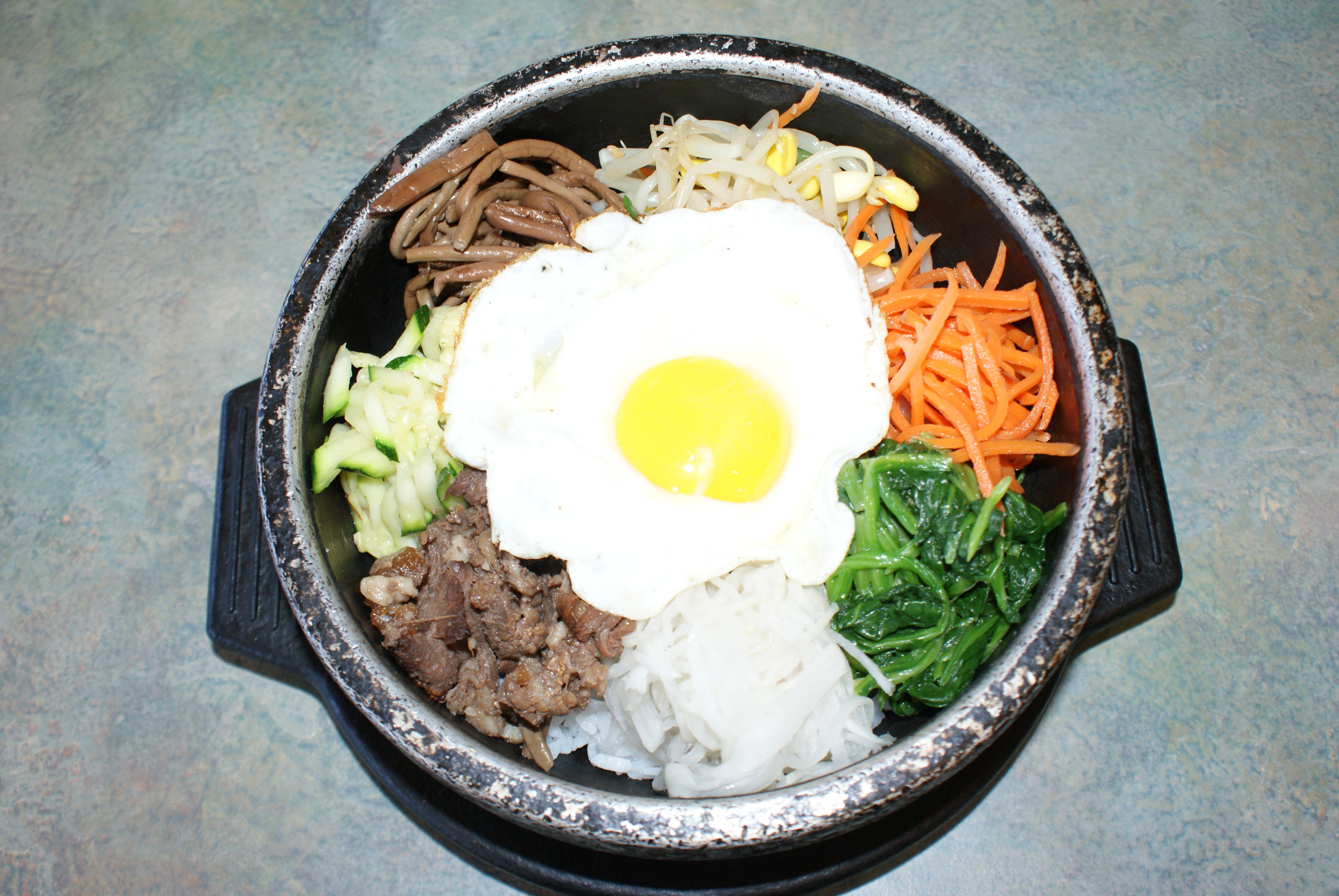 Order 3. Ya Chae Dol Sot Bi Bim Bab food online from Shu's Korean Restaurant store, Santa Clara on bringmethat.com