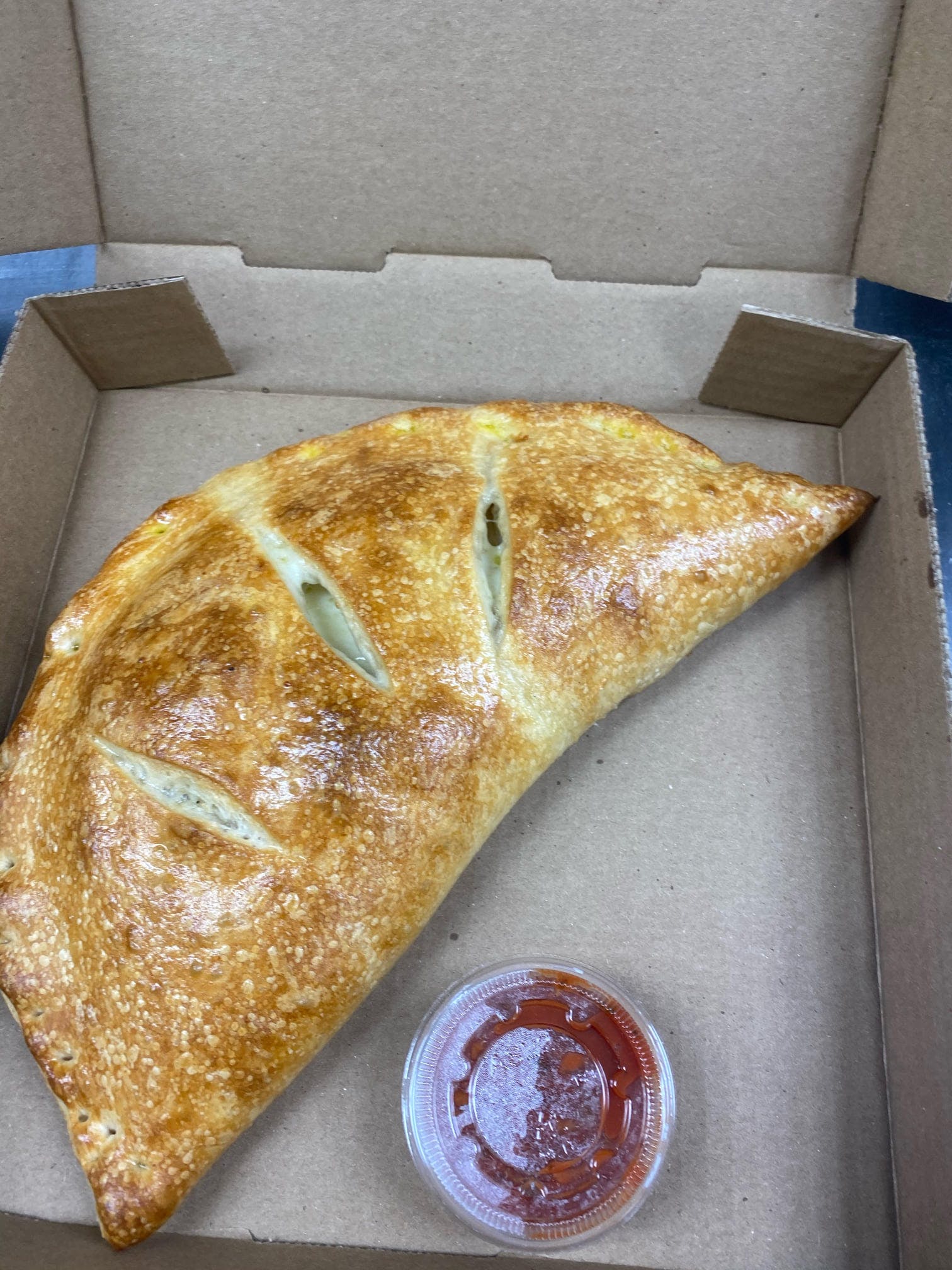 Order Meat Calzone - Calzone food online from Zeno Italian Grill store, Pembroke on bringmethat.com