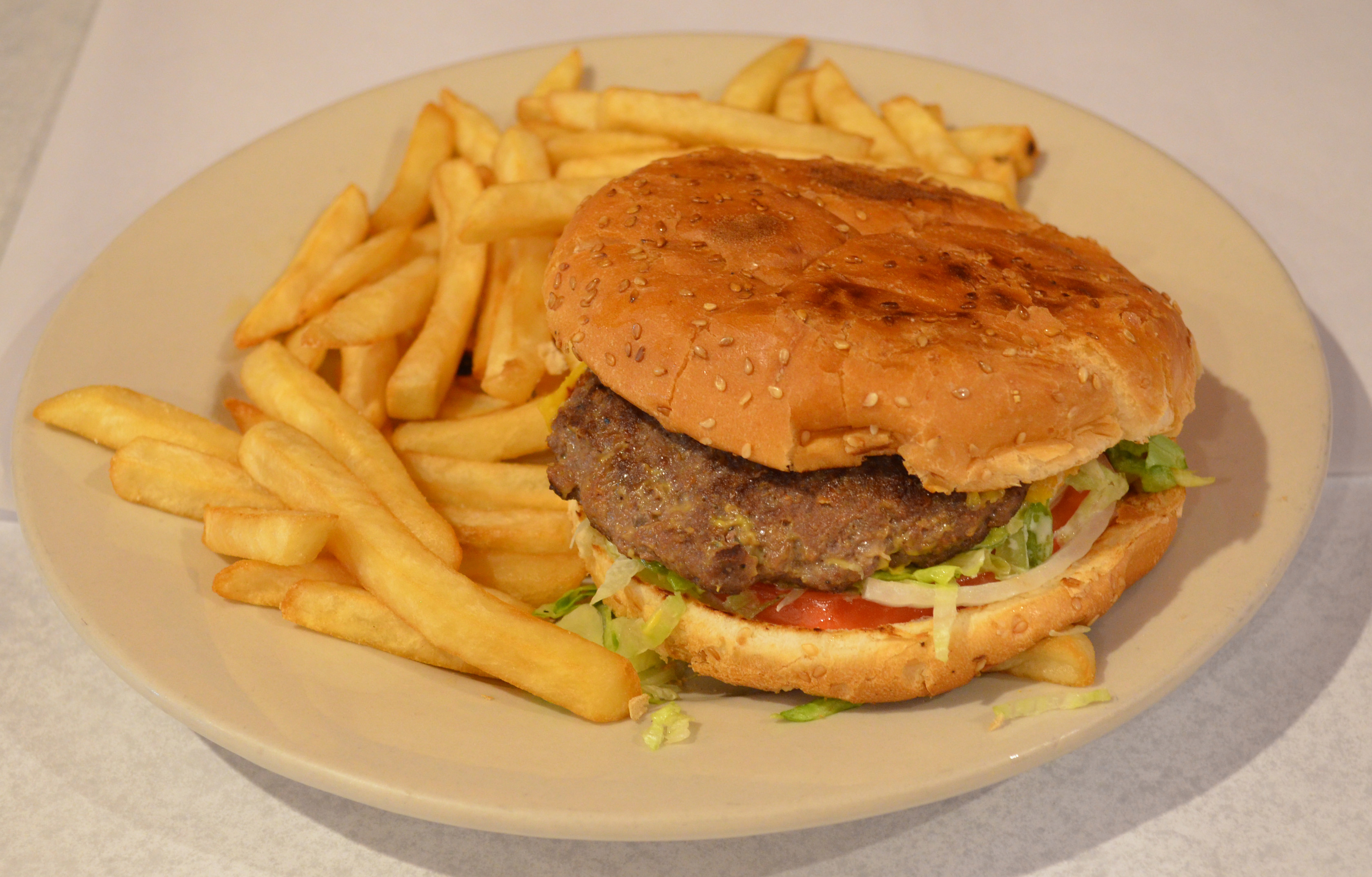 Order Beef Burger with French fries food online from Pancho Villa Restaurant store, Bronx on bringmethat.com