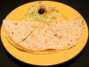 Order I. Folded Cheese Crisp with Red or Green Chili con Carne food online from Manuel Mexican Restaurant store, Chandler on bringmethat.com