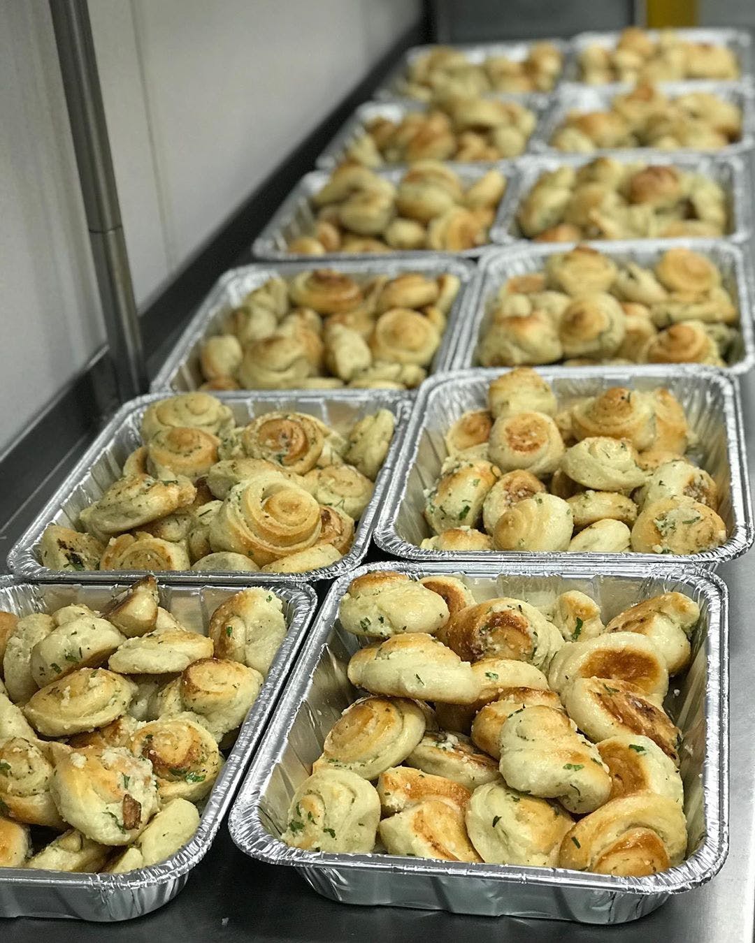 Order Garlic Knots Catering - Half Pan food online from Planet Pizza store, Ridgefield on bringmethat.com