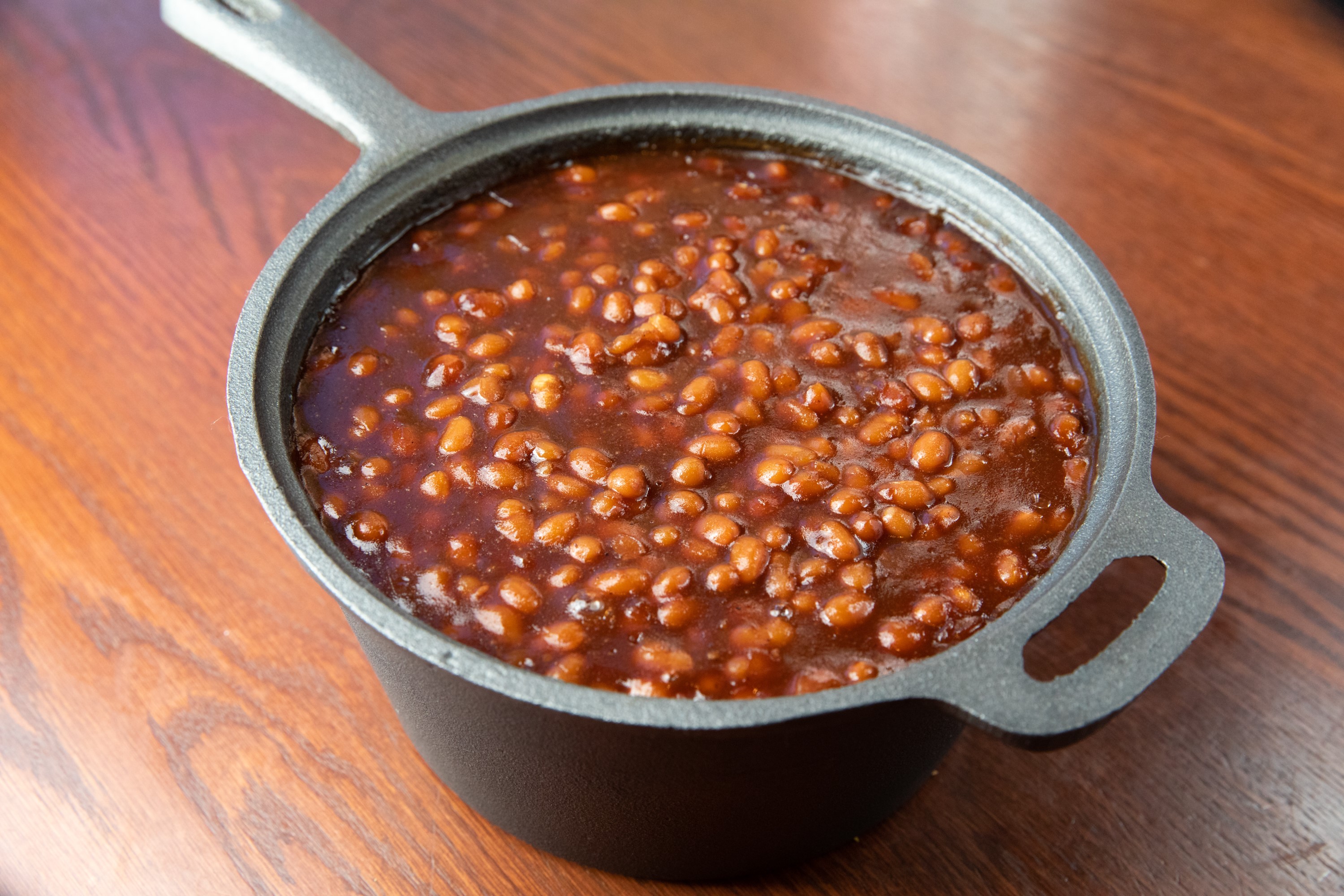 Order House Made BBQ Baked Beans food online from Smokey Bones store, Springfield on bringmethat.com