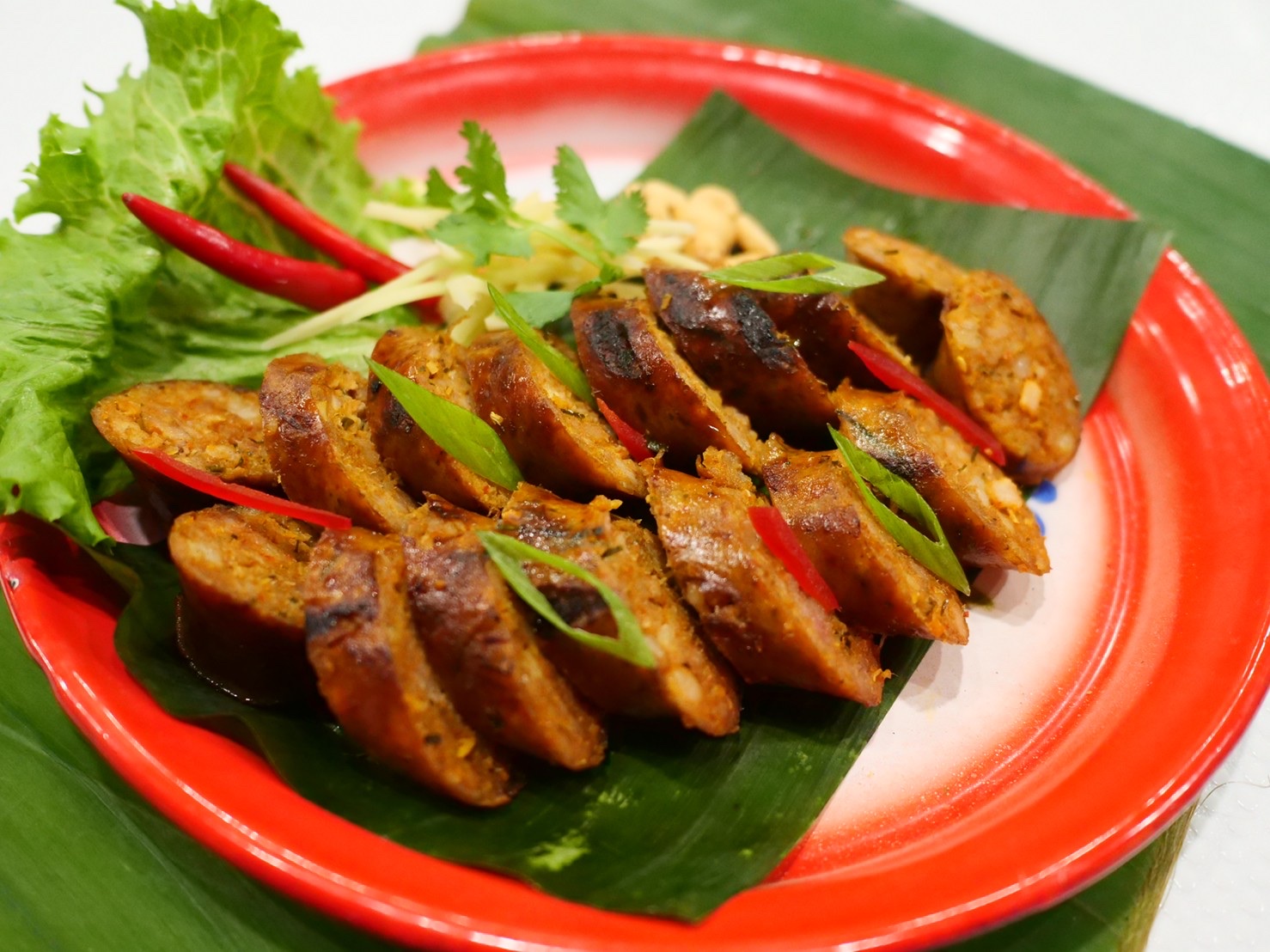 Order Sai Oua (Chiang Mai Sausage) food online from Lan Larb store, New York on bringmethat.com