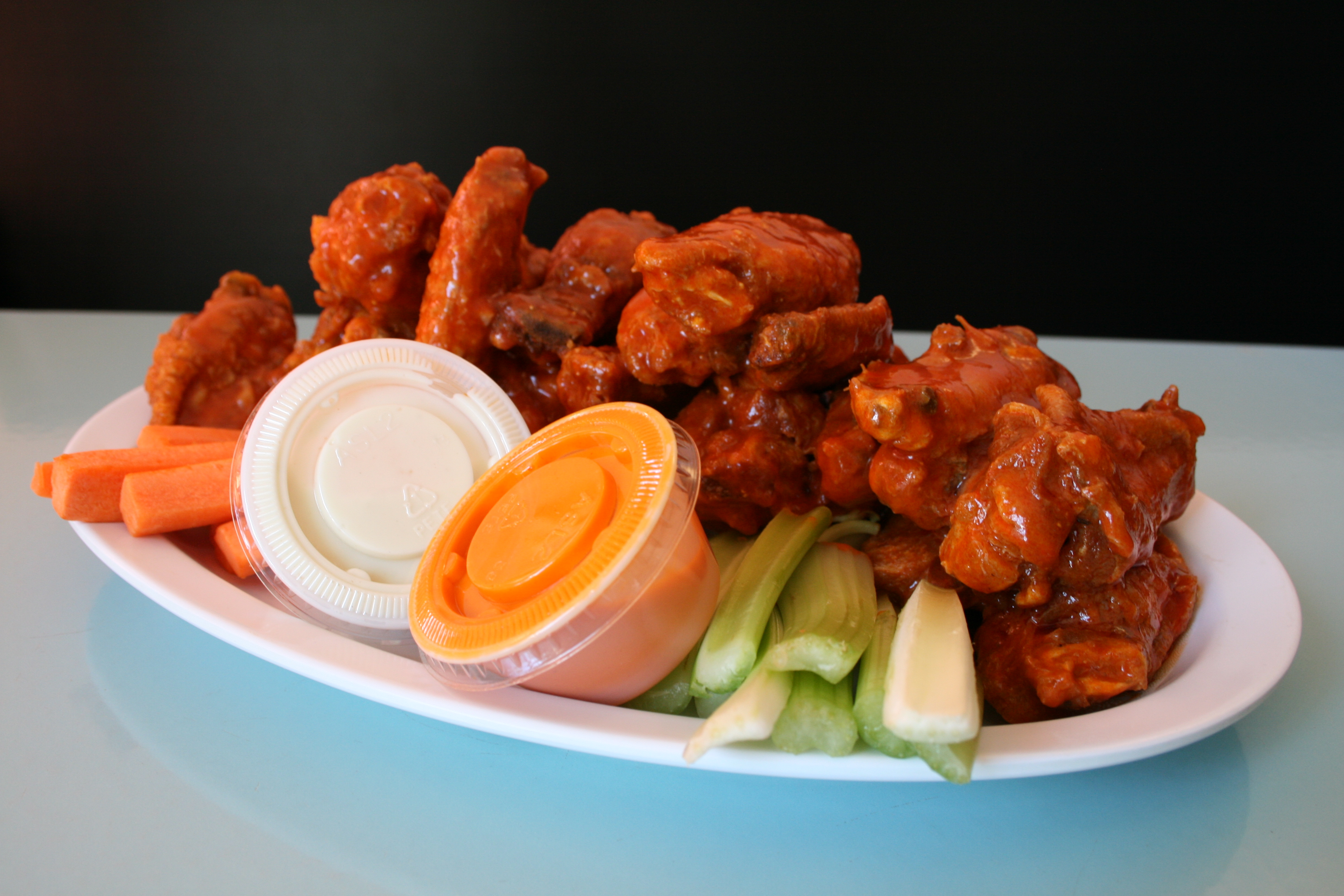 Order 20 pc Buffalo Wings with Two Sauces food online from Aldo'S Wraps Spot store, Albany on bringmethat.com