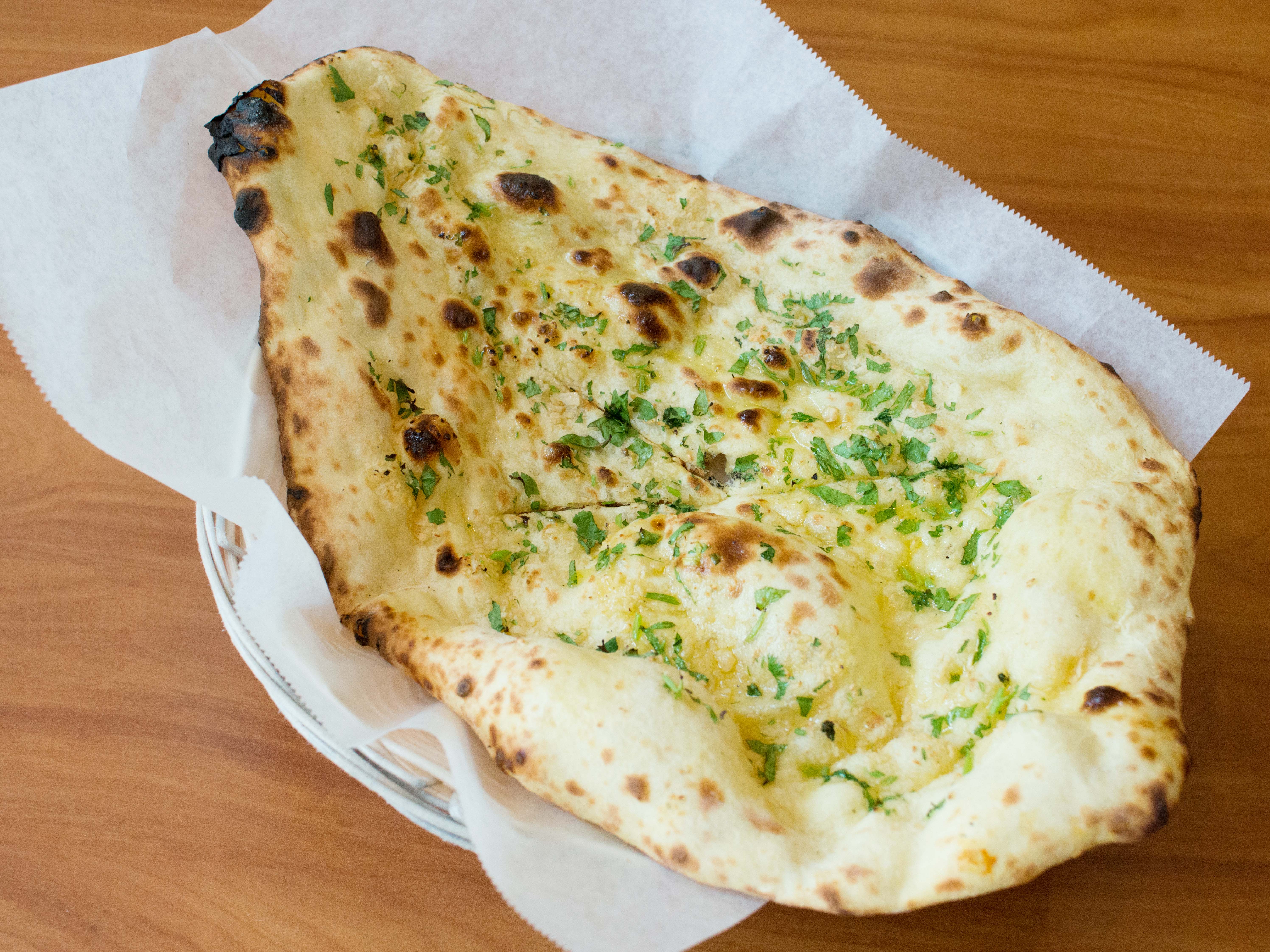 Order Garlic Naan food online from Marigold Maison store, Lincolnshire on bringmethat.com