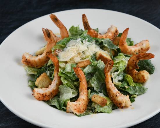 Order Big Islander Caesar Salad with Shrimp food online from Rainforest Cafe store, Nashville on bringmethat.com