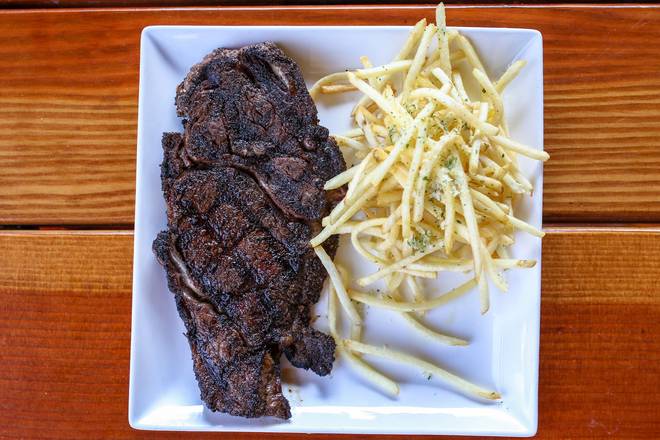 Order NY Strip Steak (14 oz) food online from Tommy Tavern + Tap store, Parsippany on bringmethat.com