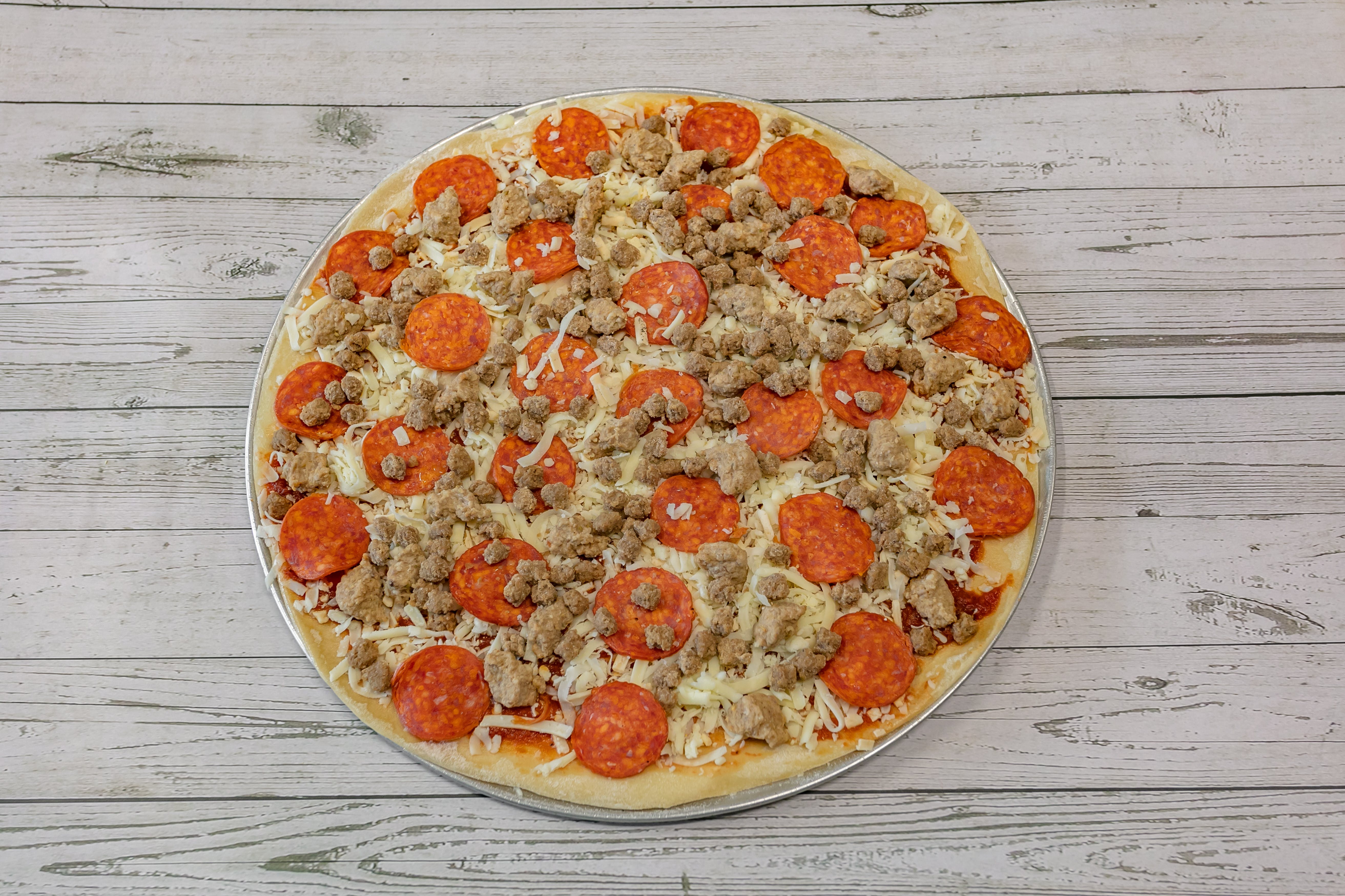 Order Meat Lovers Pizza - Medium 14'' food online from Paws Pizza store, Marble Hill on bringmethat.com