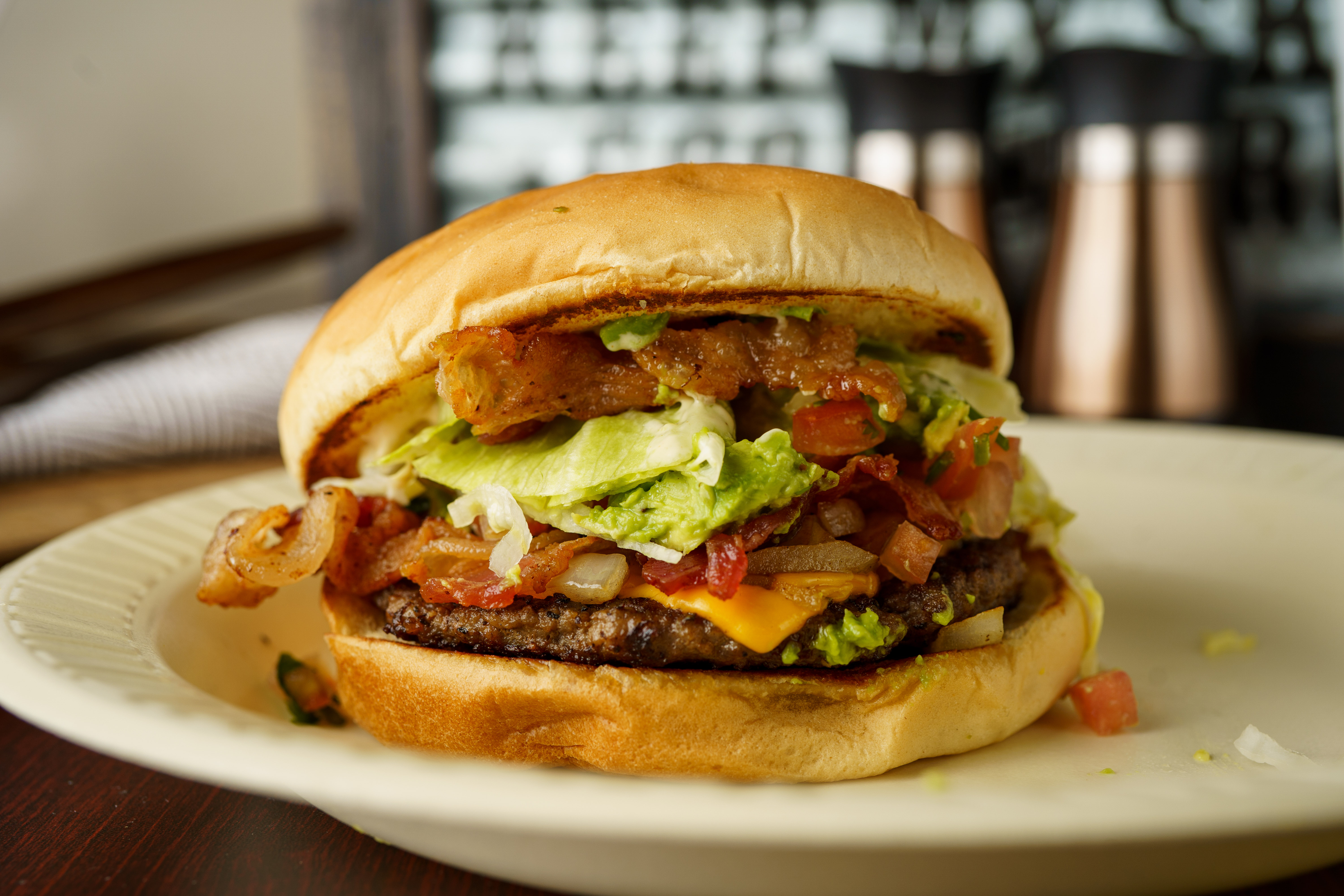 Order Avocado Bacon Burger food online from NacBurger store, Nacogdoches on bringmethat.com