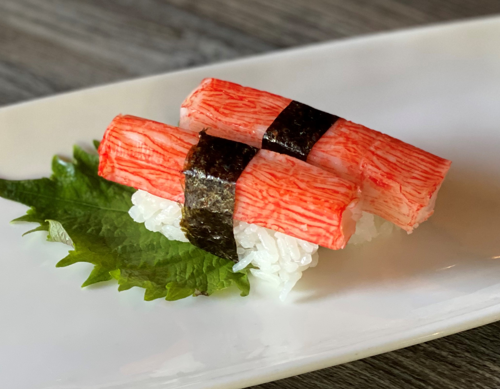 Order Crab Stick Nigiri food online from Sushi Confidential store, Campbell on bringmethat.com