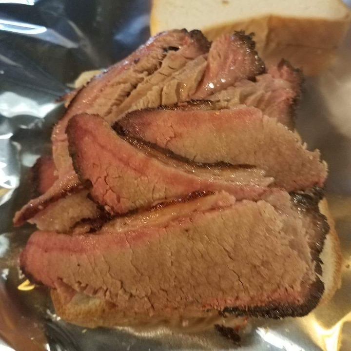 Order 1 lb Sliced Brisket food online from Gilbert & Co. Bbq store, Humble on bringmethat.com