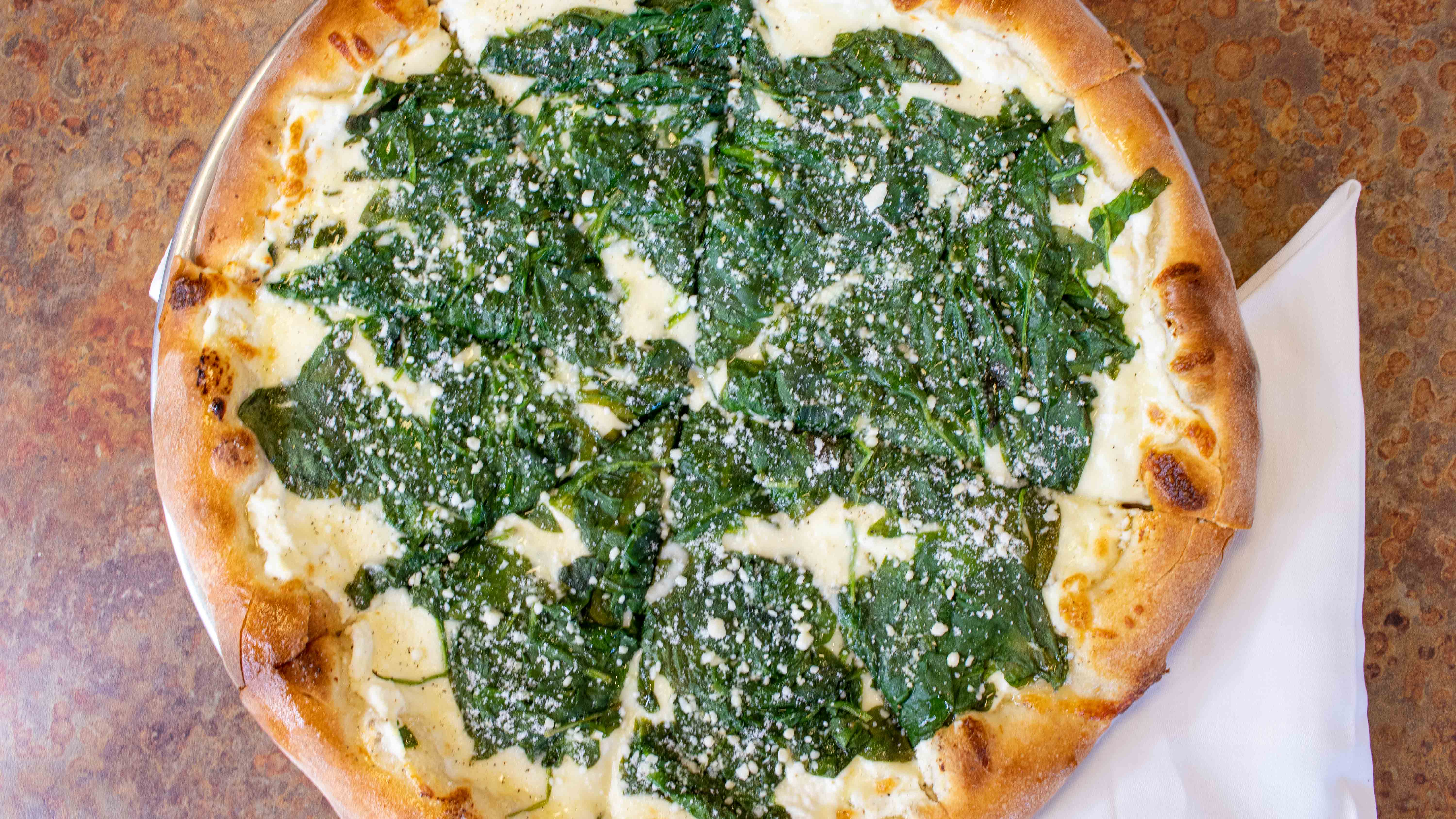Order Spinach 4 Cheese  Pizza food online from Carmelos Italian Pizza store, Caledonia on bringmethat.com