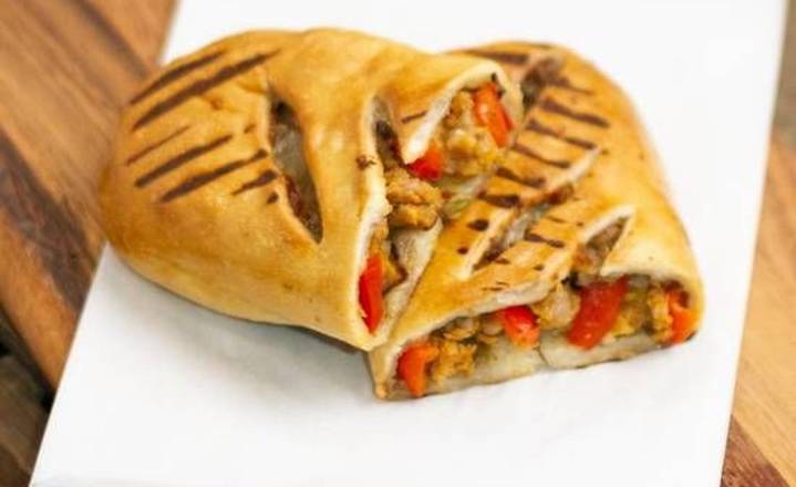 Order Sausage & Roasted Pepper Calzone food online from Caffe Nero store, Boston on bringmethat.com