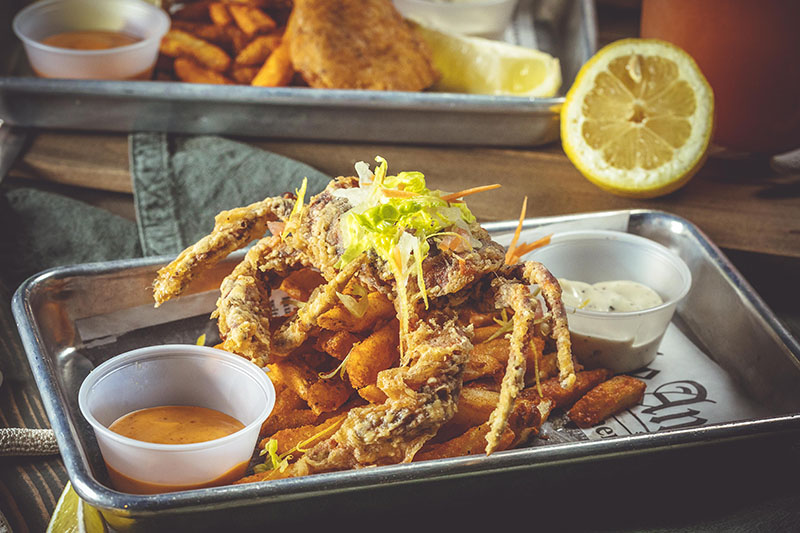 Order Fried Soft Shell Crab with Cajun Fries food online from Holy Crab Cajun Seafood store, White Plains on bringmethat.com