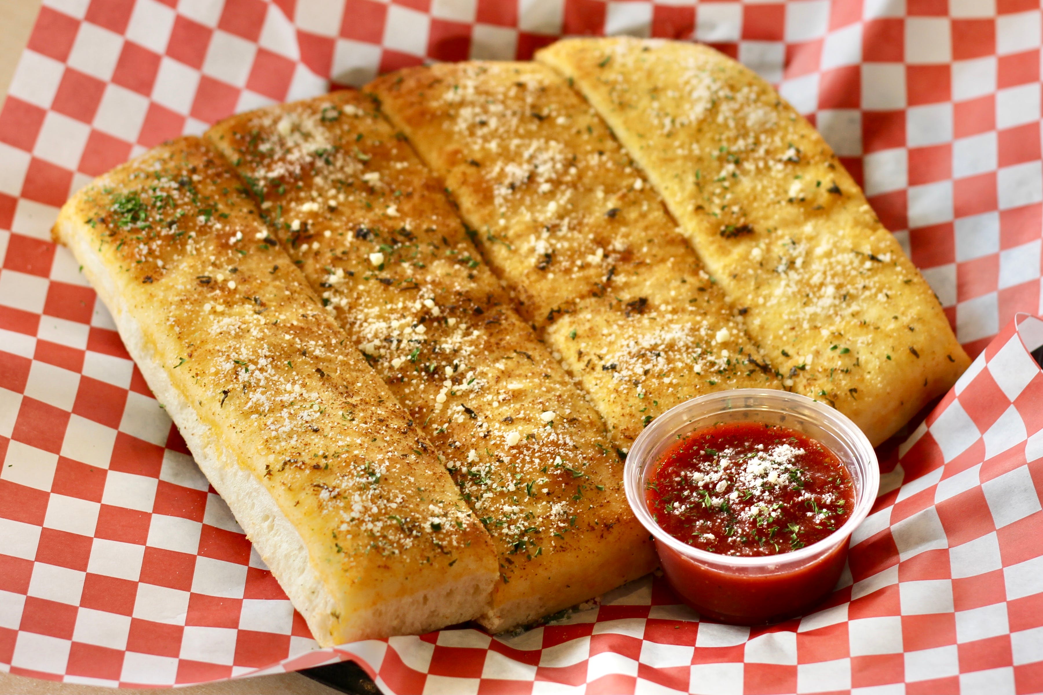 Order Garlic Bread - 4 Pieces food online from California Pizza Place store, Anaheim on bringmethat.com