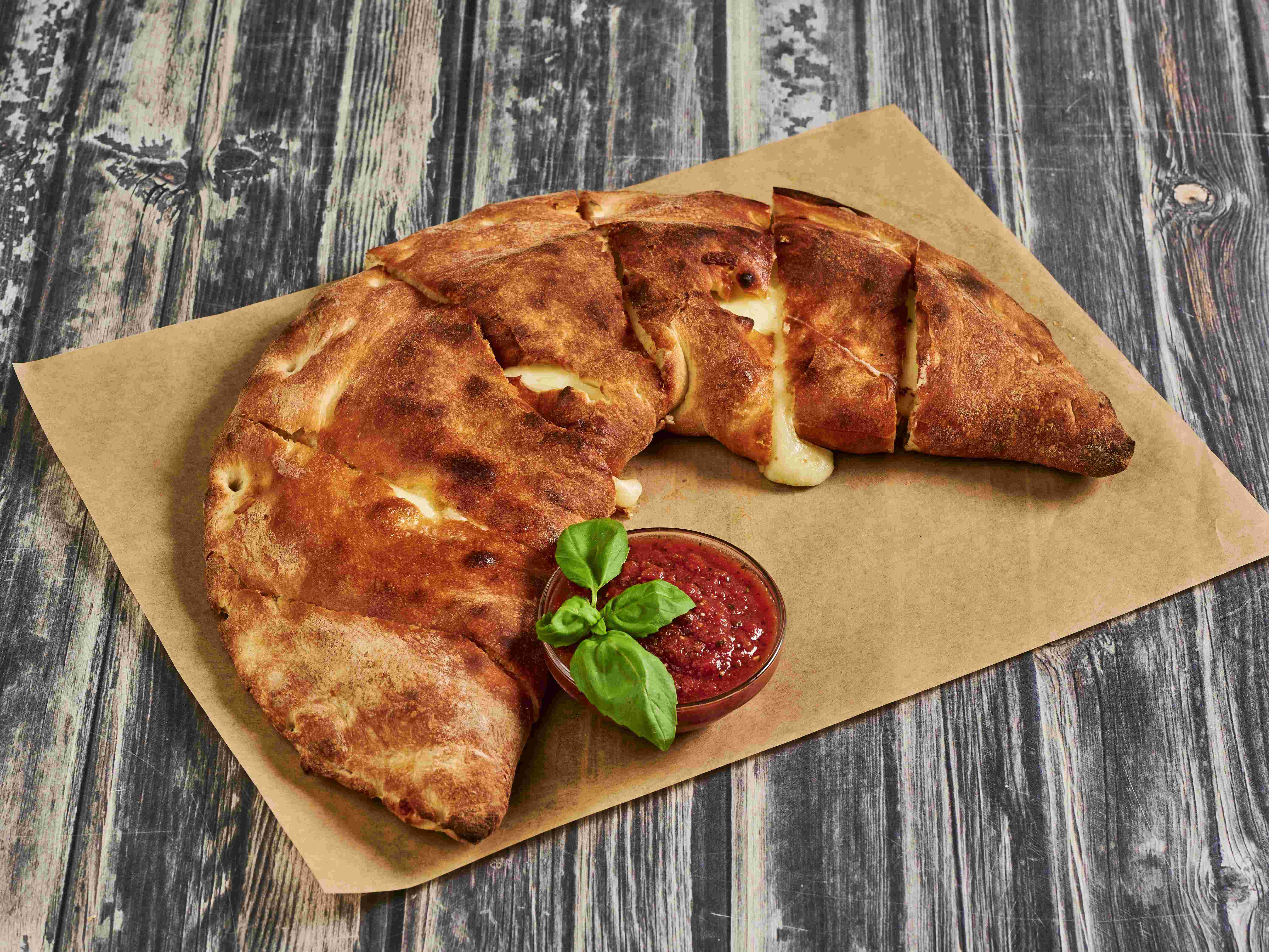 Order Mozzarella, Ricotta Cheese and Pizza Sauce Calzone food online from Pizza Express store, San Francisco on bringmethat.com