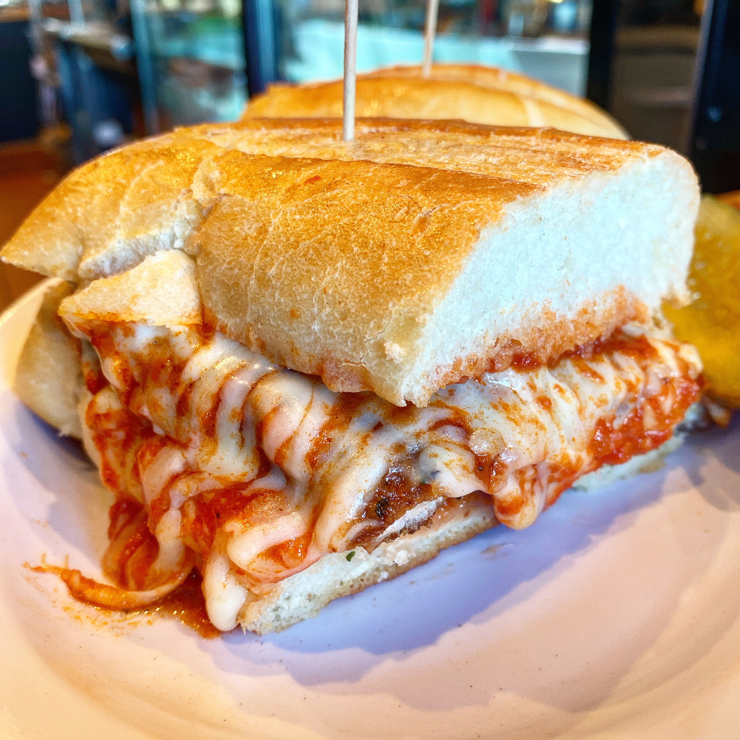 Order Chicken Parmesan Sandwich on a cibata Roll food online from Metropolitan Cafe store, Fairview on bringmethat.com