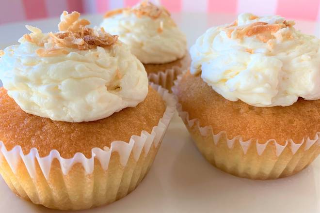 Order Vanilla - Coconut Buttercream Cupcake food online from Rum Cakes Factory store, Plano on bringmethat.com
