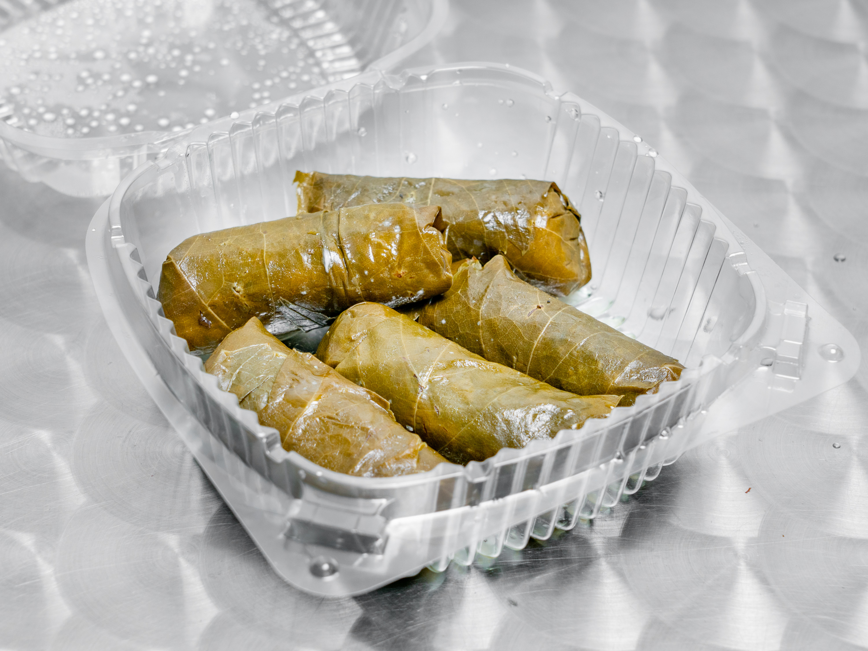 Order 4 Stuffed Grape Leaves food online from Old Town Deli store, Alexandria on bringmethat.com