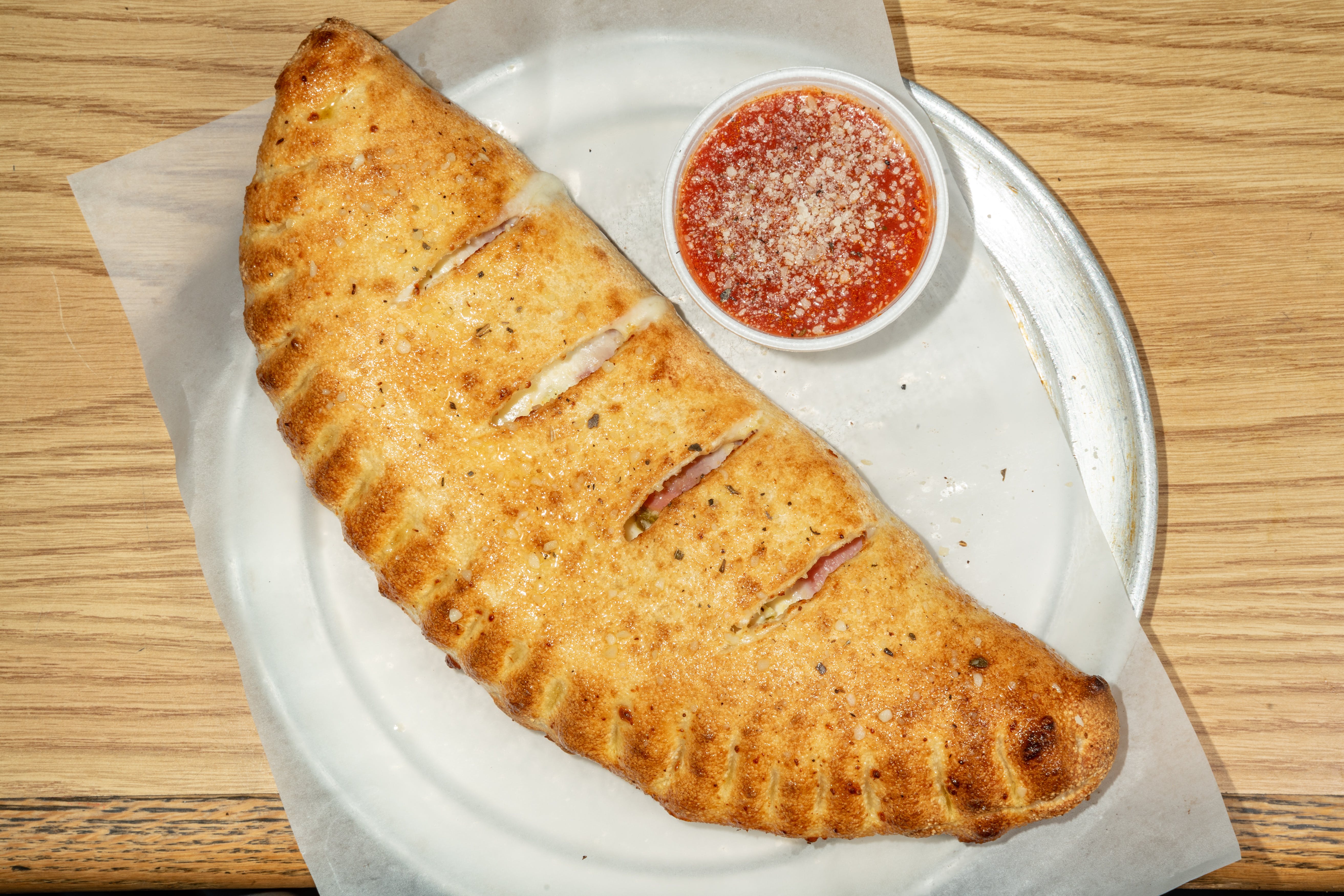 Order Calzone - Small food online from Rockyanos Pizza store, Dallas on bringmethat.com