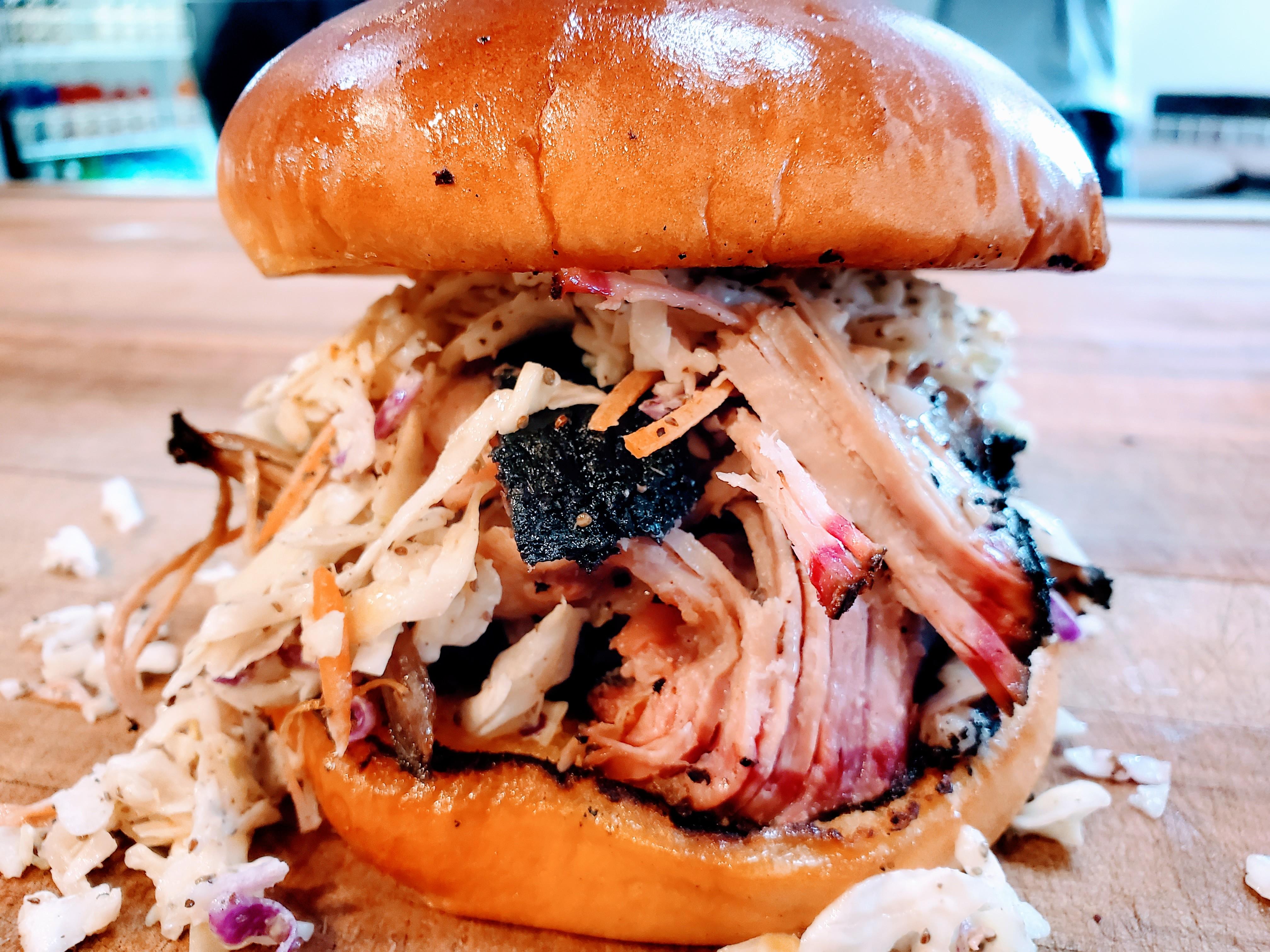 Order Pulled Pork Sandwich food online from Holy Smokes Bbq store, Monroeville on bringmethat.com