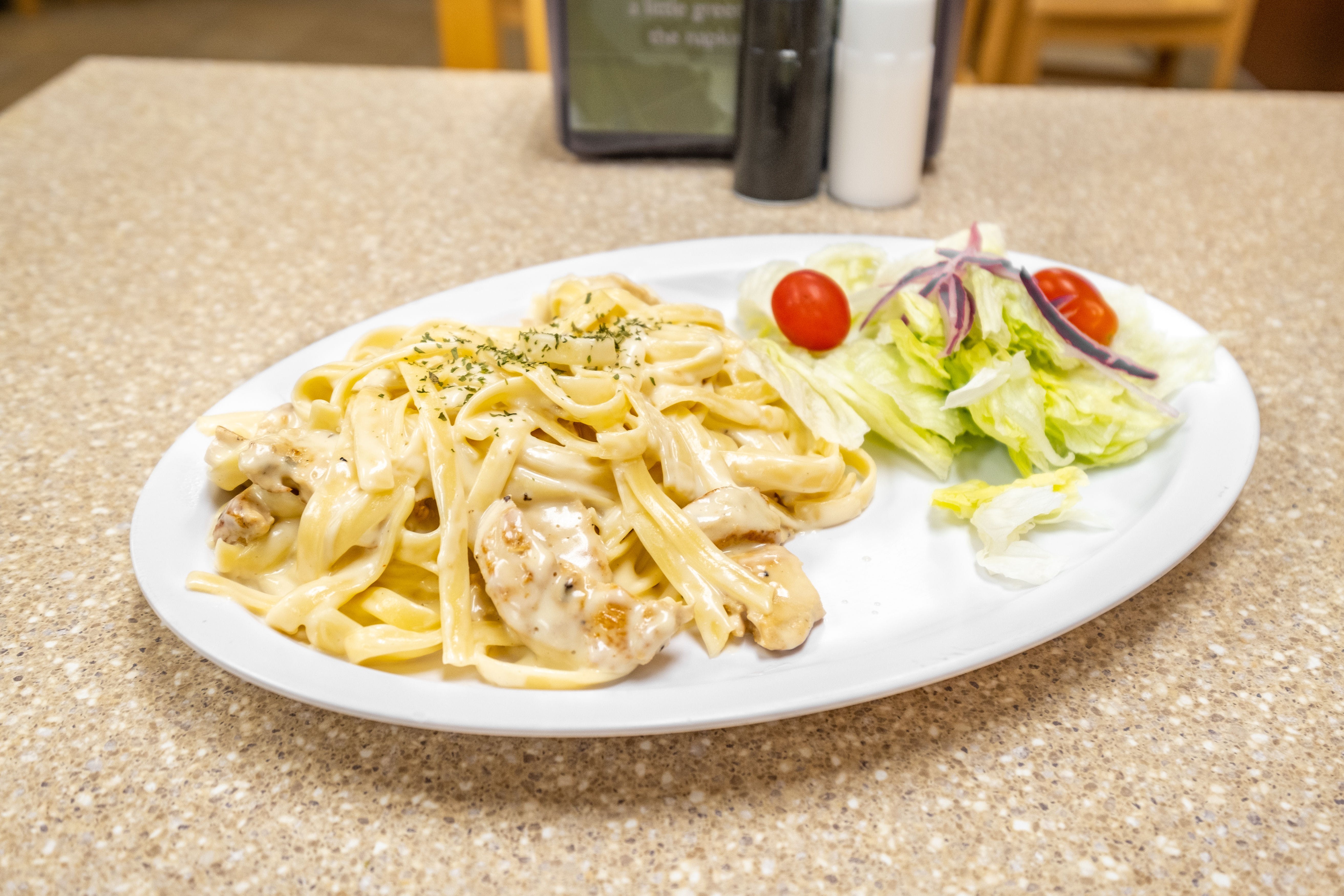 Order Fettuccine Alfredo with Chicken - Entree food online from Roma Breakfast & Pizzeria store, Columbia on bringmethat.com