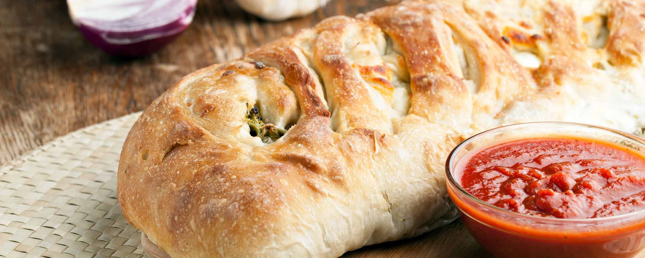 Order Cheese Stromboli - Large food online from King of Pizza store, Berlin on bringmethat.com