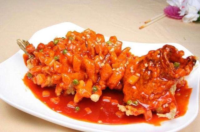 Order 83.	Crispy Whole Fish Topped w. Pine Nuts 	in Sweet & Sour Sauce	松鼠全魚 food online from Szechuan Gourmet store, New York on bringmethat.com
