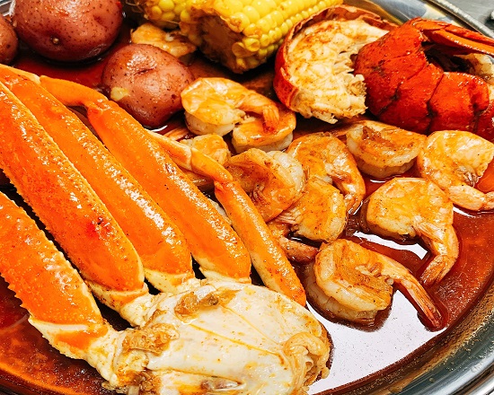 Order Combo E food online from Juicy Seafood store, Evansville on bringmethat.com