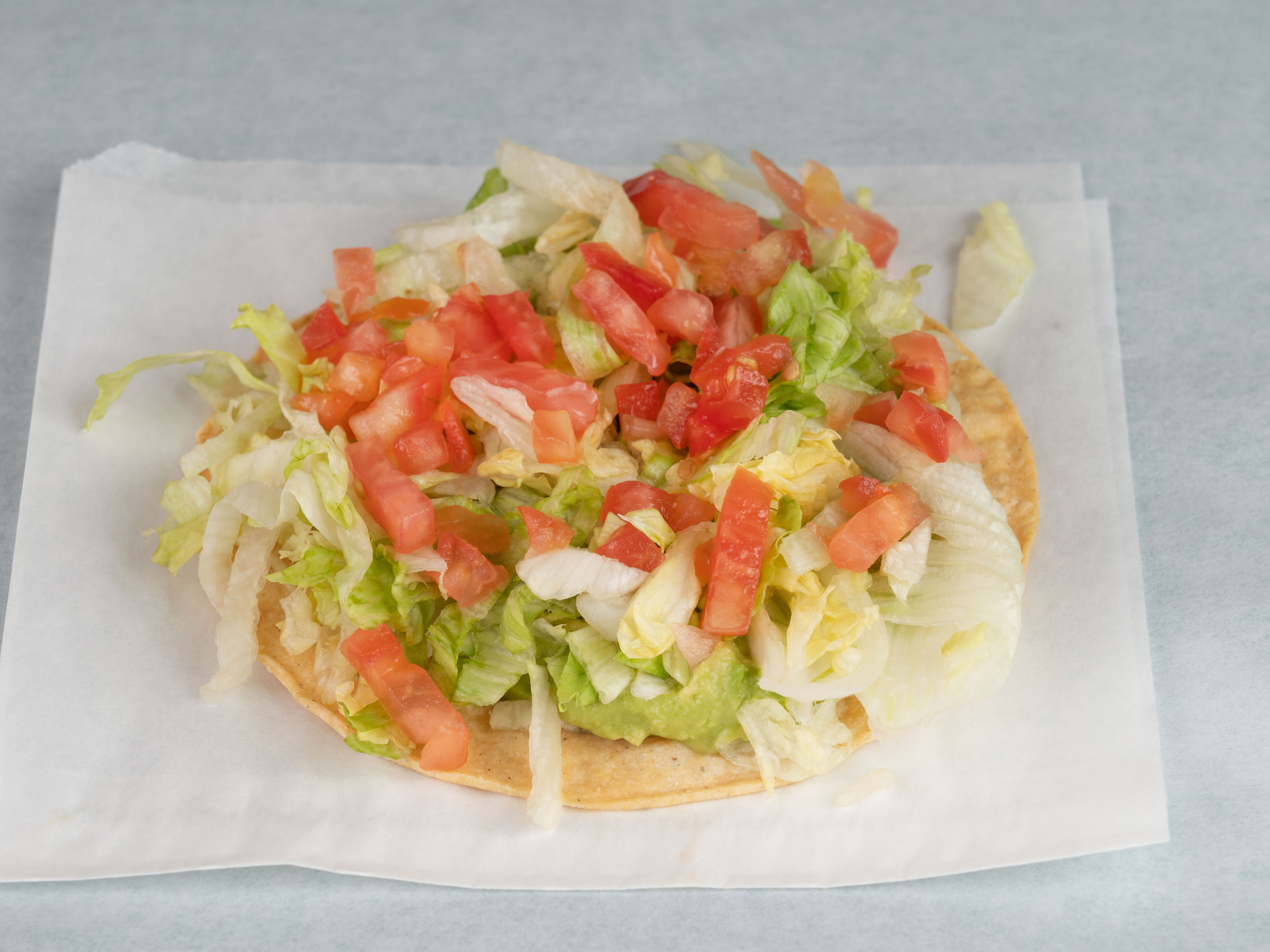 Order Guacamole Tostada food online from Pepe's Mexican Cafe store, Bryan on bringmethat.com