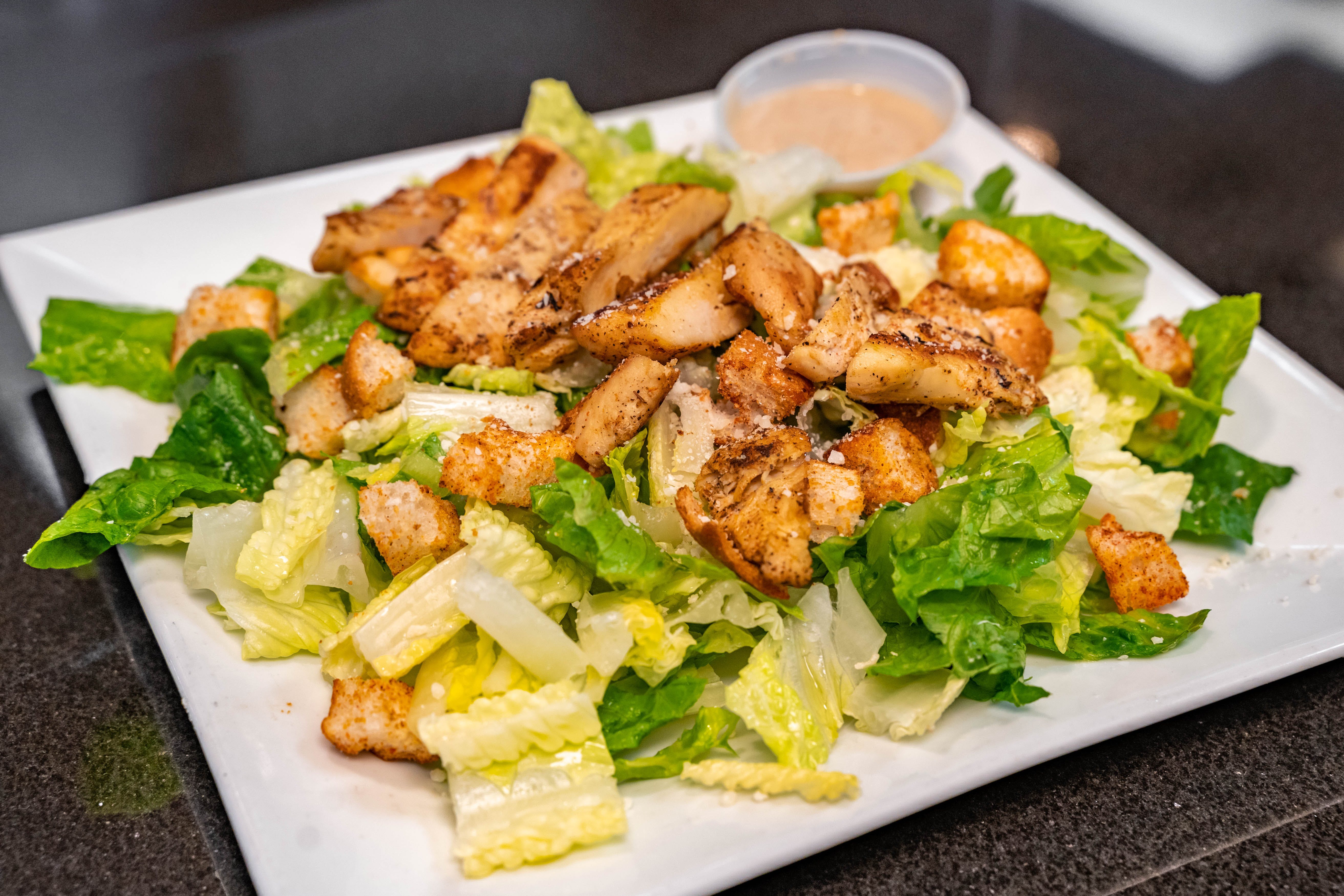 Order Caesar Salad - Salad food online from Father & Sons store, Woodbury on bringmethat.com