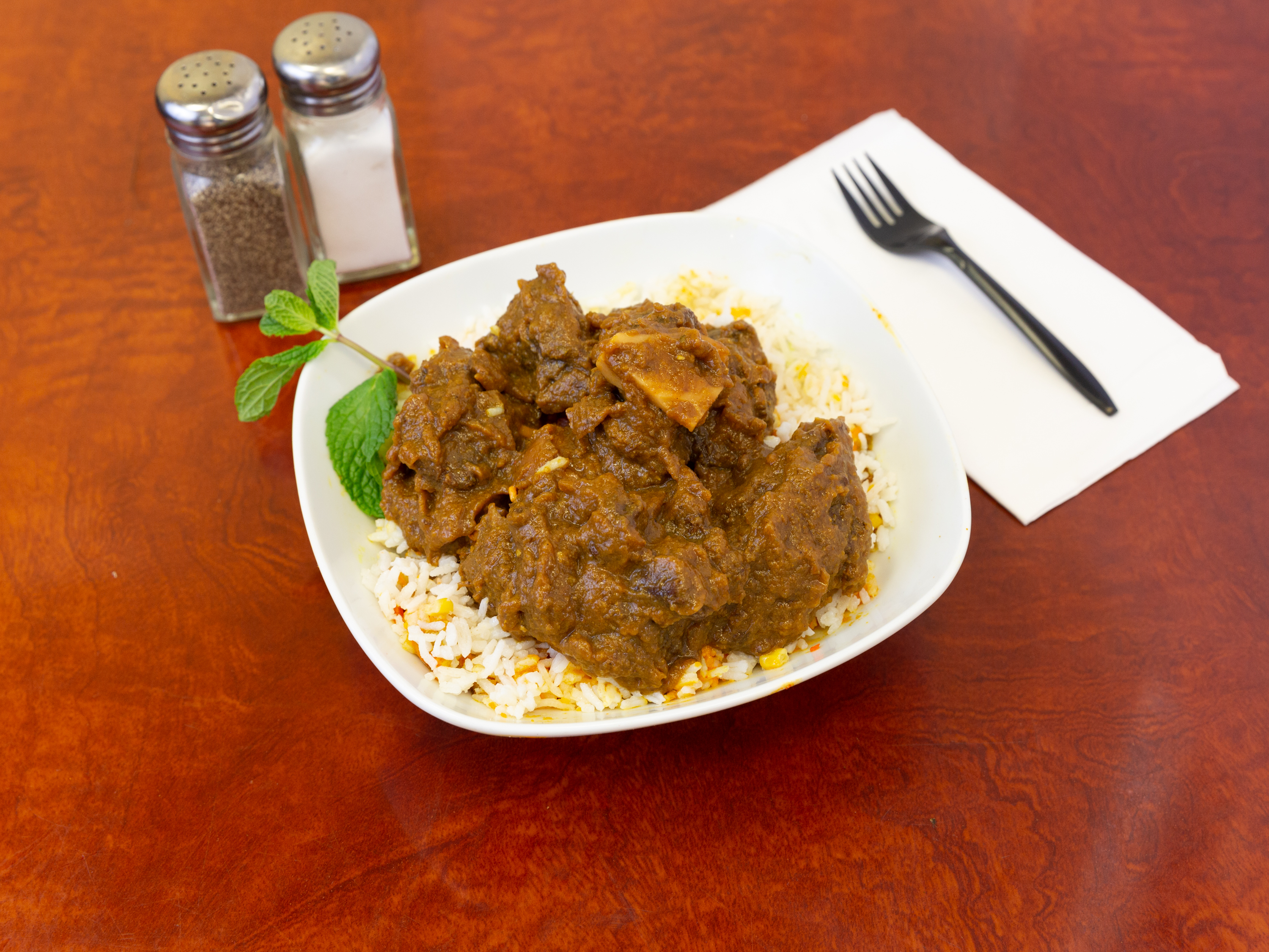 Order Goat Curry food online from Golden Indian Grill & Pizza store, Los Angeles on bringmethat.com