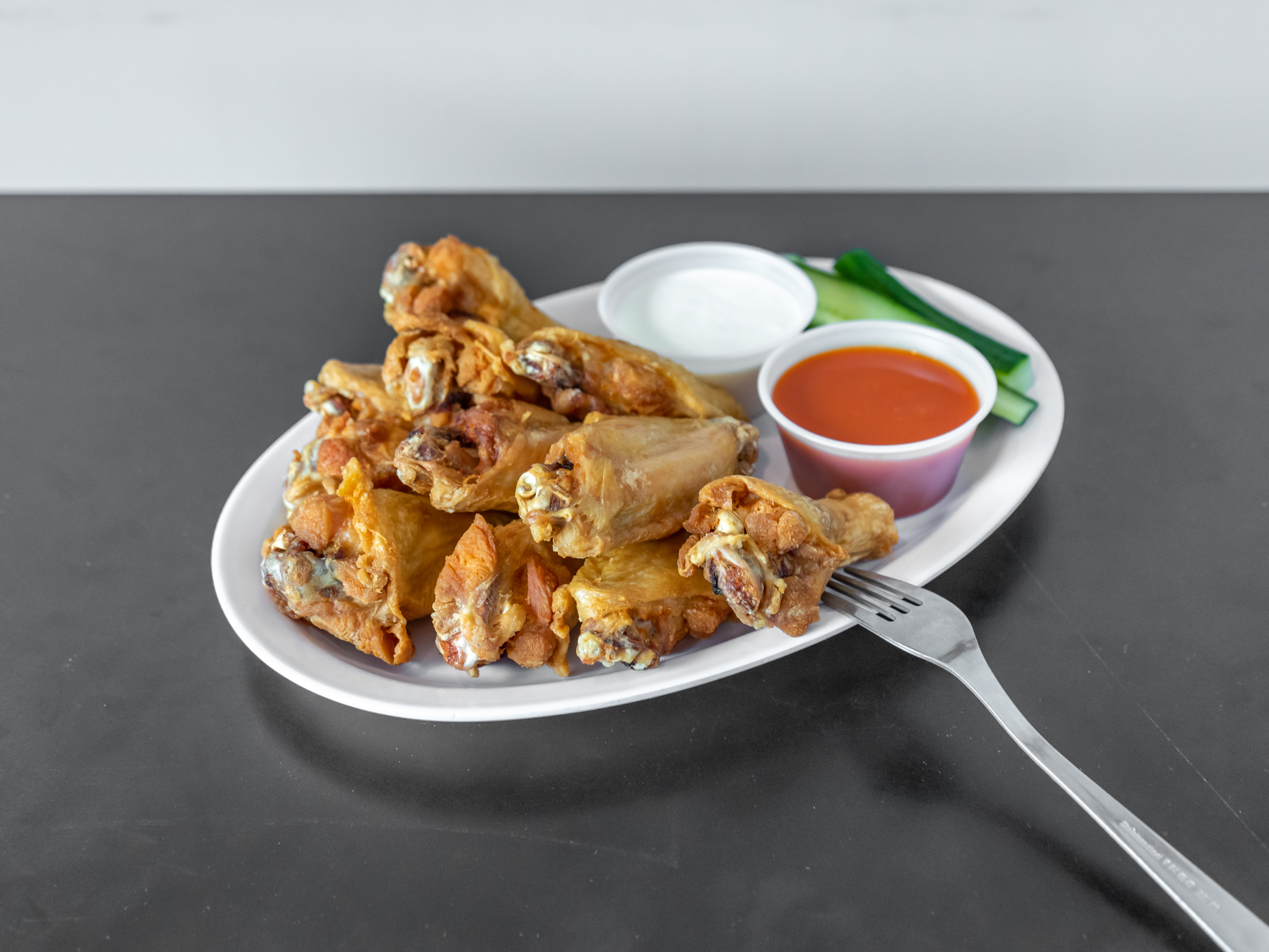Order Buffalo Wings food online from Mikes Pizzeria store, Manchester on bringmethat.com