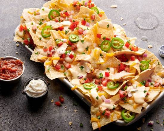 Order Legendary Loaded Nachos food online from American Grilled Cheese Company store, Victor on bringmethat.com